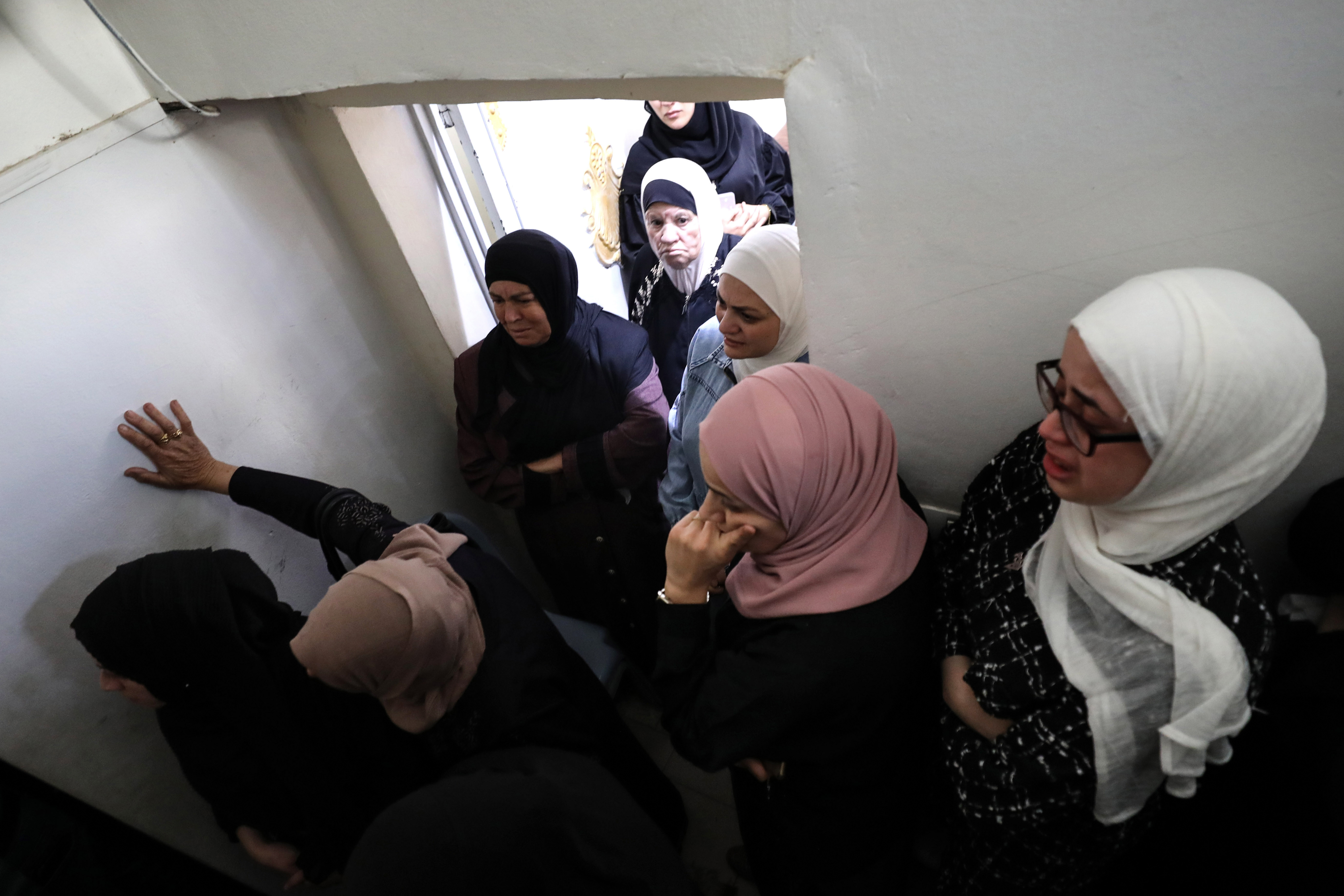 Dunya banging on the mortuary coolers in despair