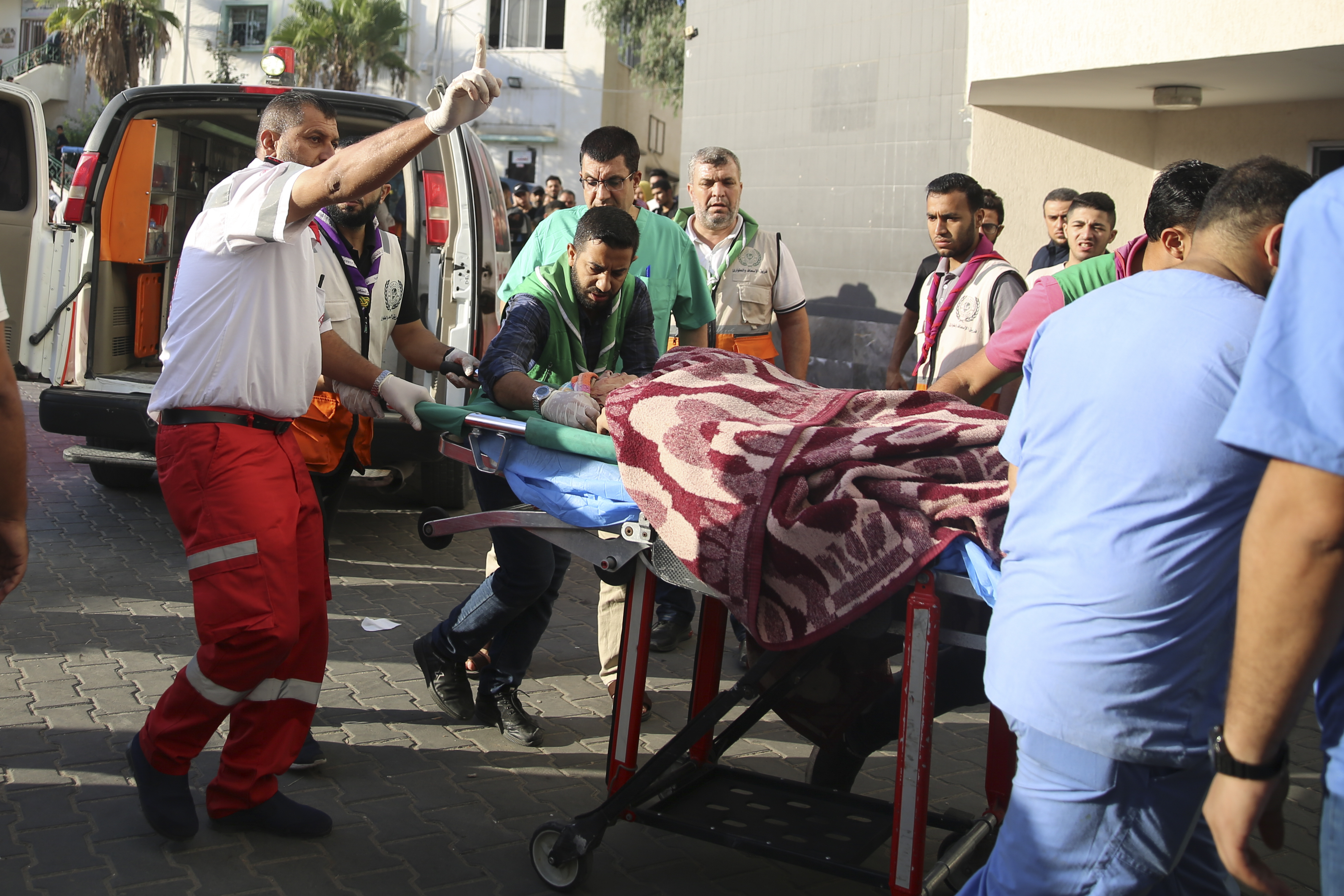 Palestinian wounded in Israeli strikes is brought to Shifa Hospital in Gaza City