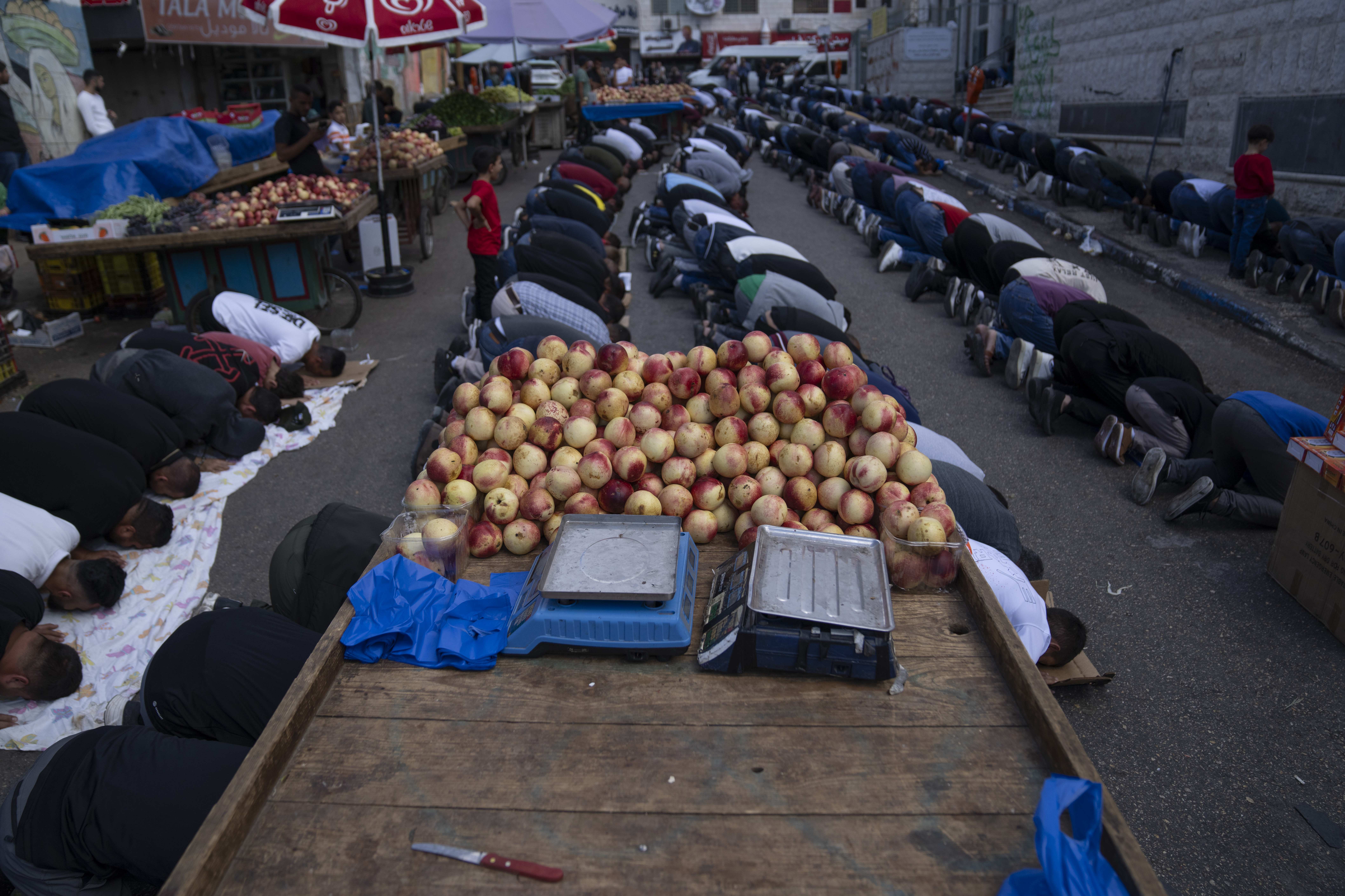 Palestinians attend Friday noon prayers ahead of a demonstration in solidarity with the Gaza Strip, in the West Bank city of Ramallah