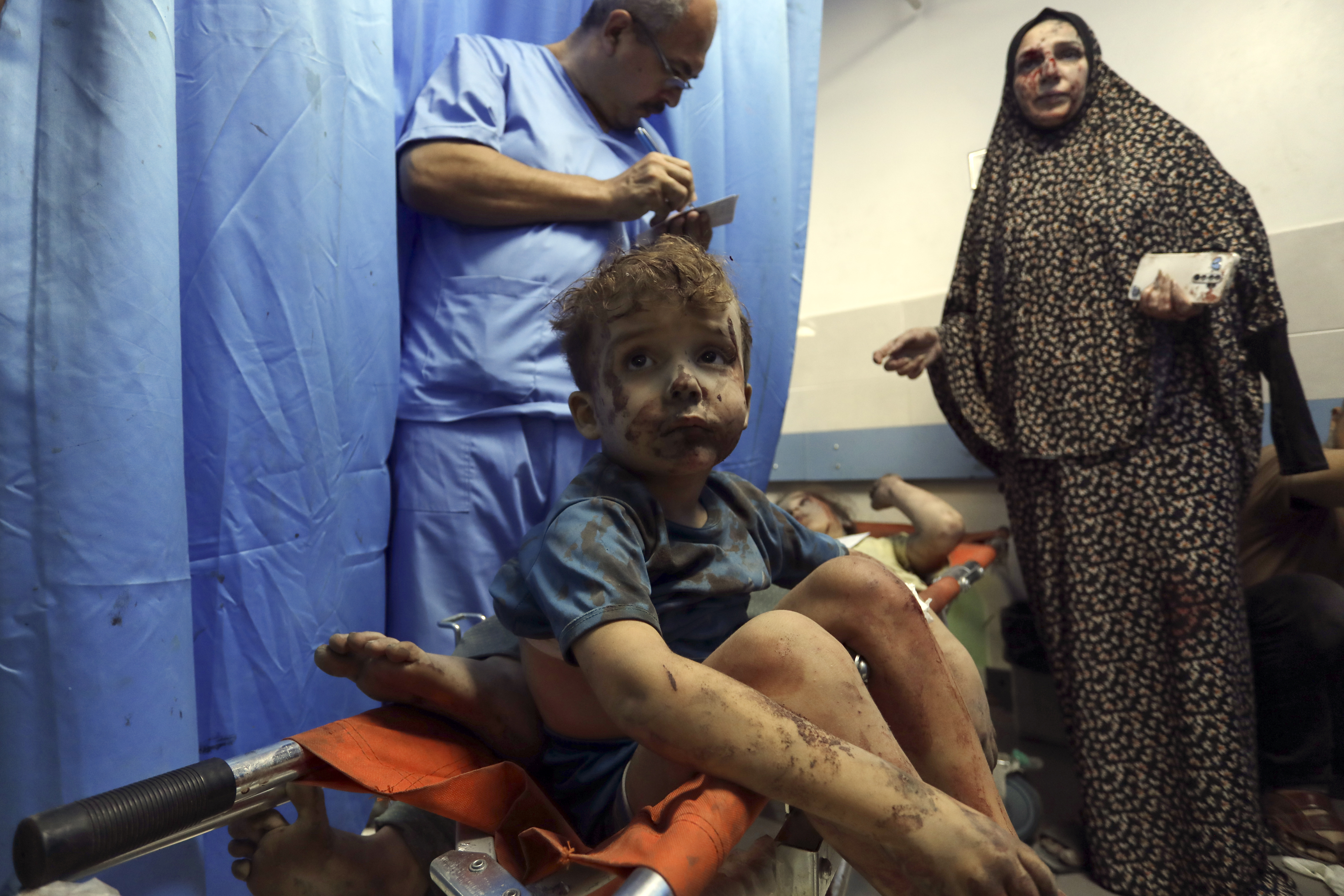 Wounded Palestinians receive treatment at the al-Shifa hospital, following Israeli airstrikes on Gaza City, Thursday, Oct. 26, 2023.