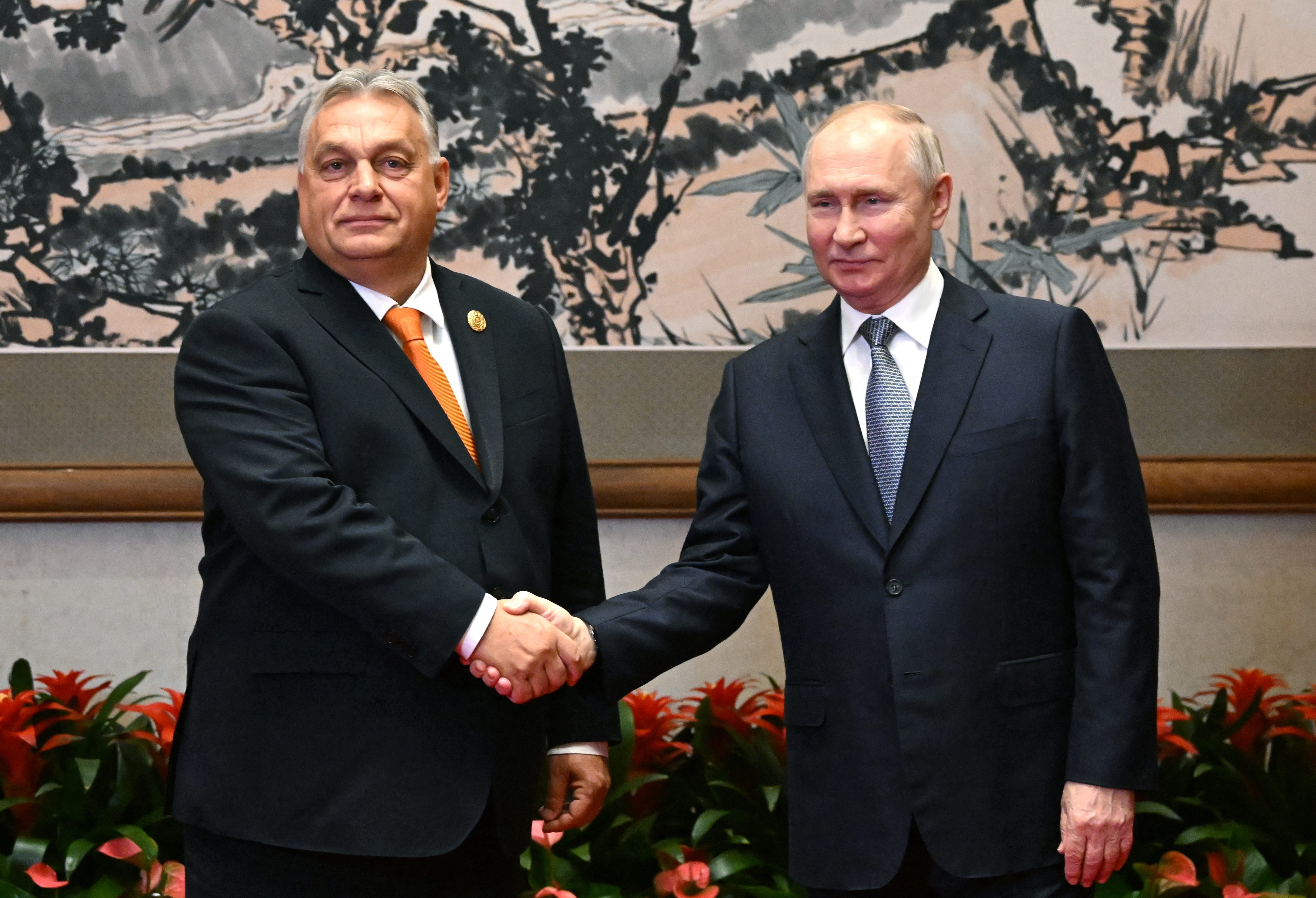 Russian President Vladimir Putin shakes hands with Hungarian Prime Minister Viktor Orban in Beijing, China, October 17, 2023. (Sputnik/Grigory Sysoyev/Pool via REUTERS)