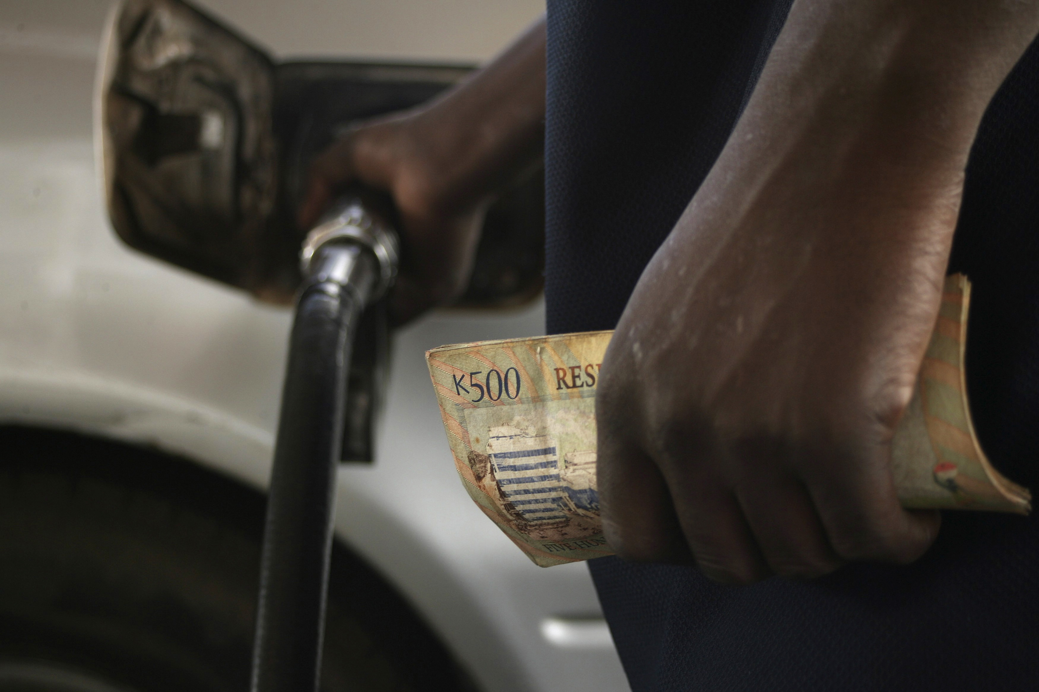 Malawian fuel attendant