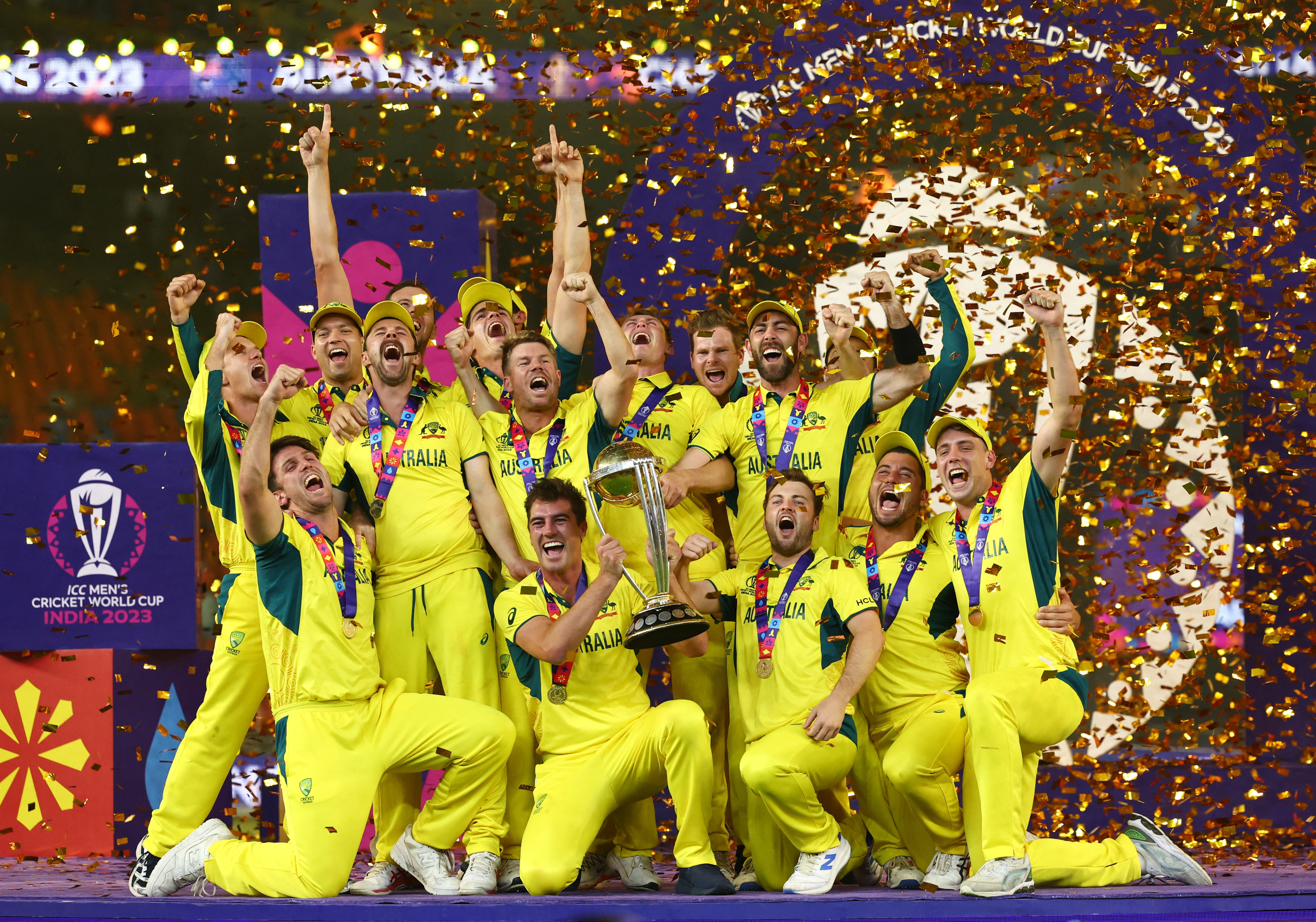 Australia players celebrate with the trophy