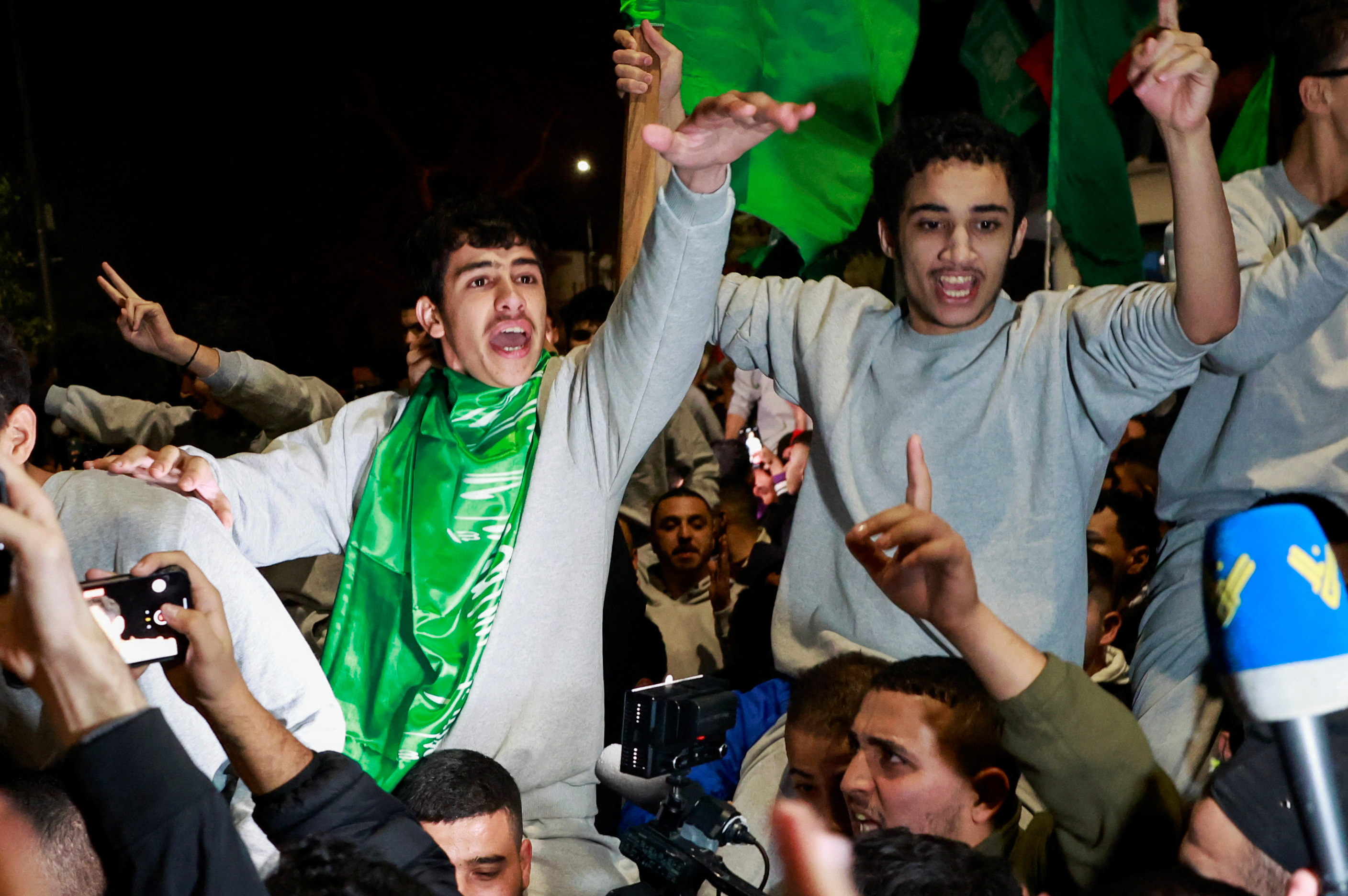 Released Palestinian prisoners react after leaving the Israeli military prison, Ofer, amid a hostages-prisoners swap deal between Hamas and Israel, near Ramallah in the Israeli-occupied West Bank November 26