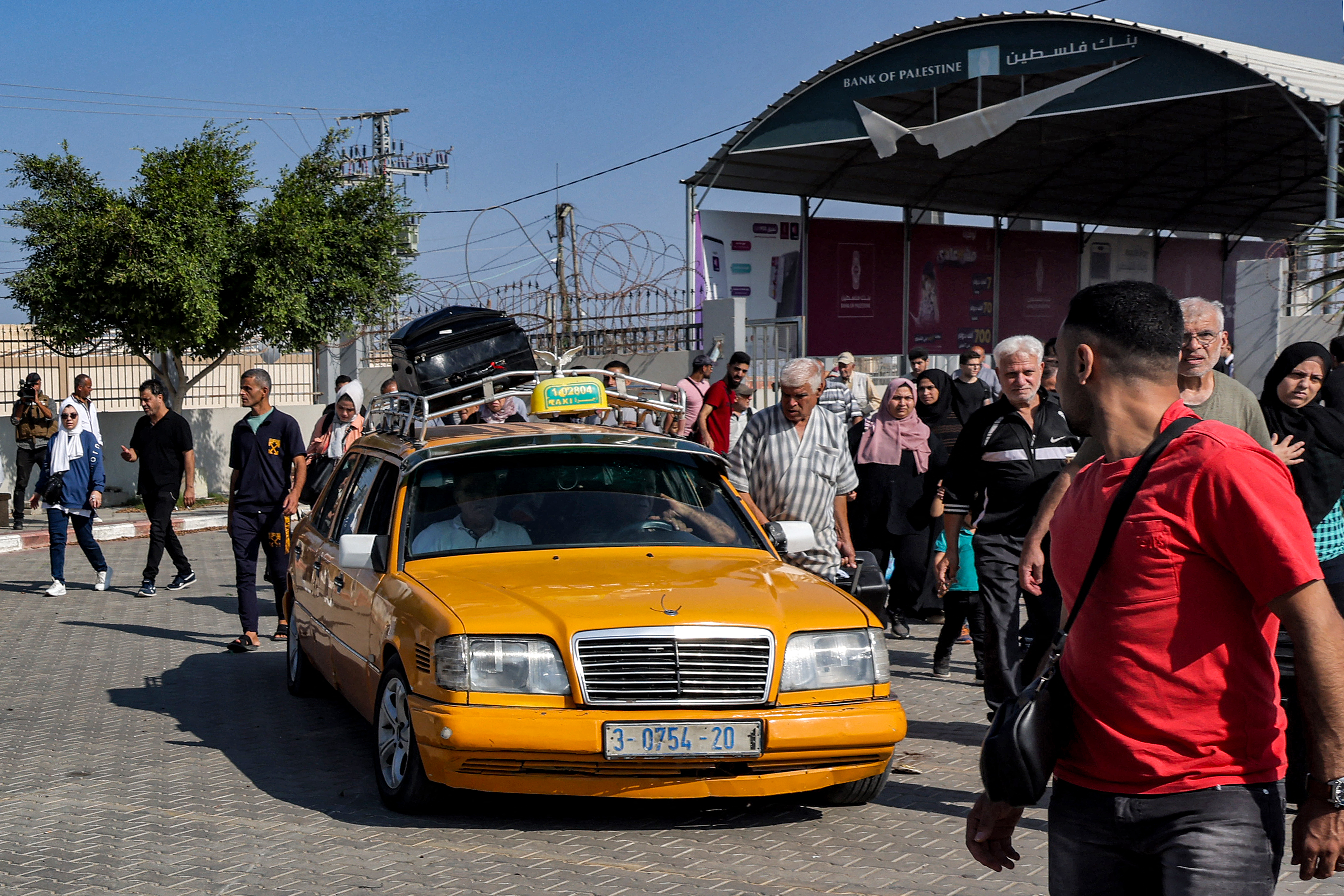 People enter the Rafah border crossing