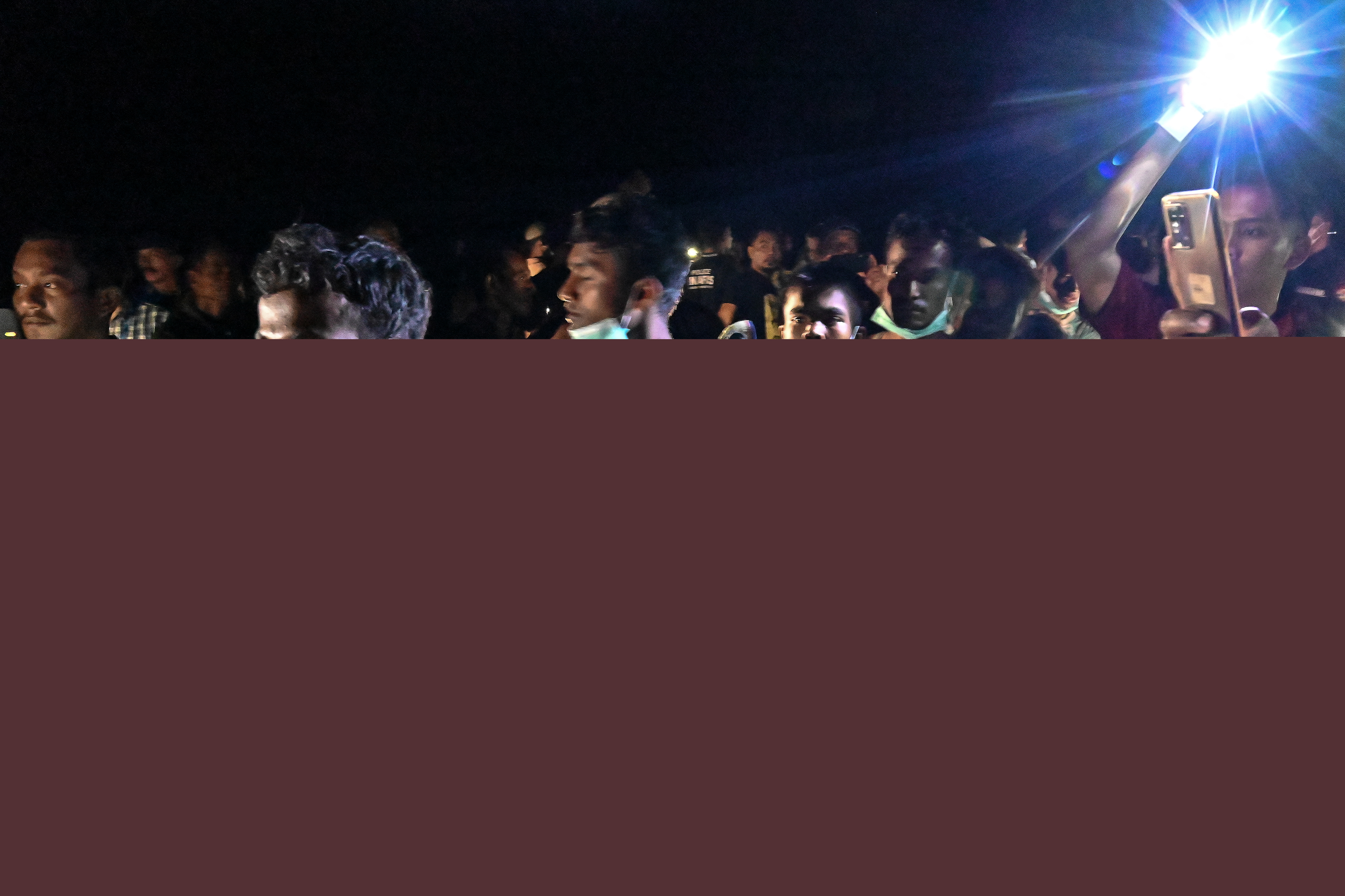 Newly-arrived Rohingya refugees move to be transferred to a shelter in Batee beach, Aceh province, Indonesia.