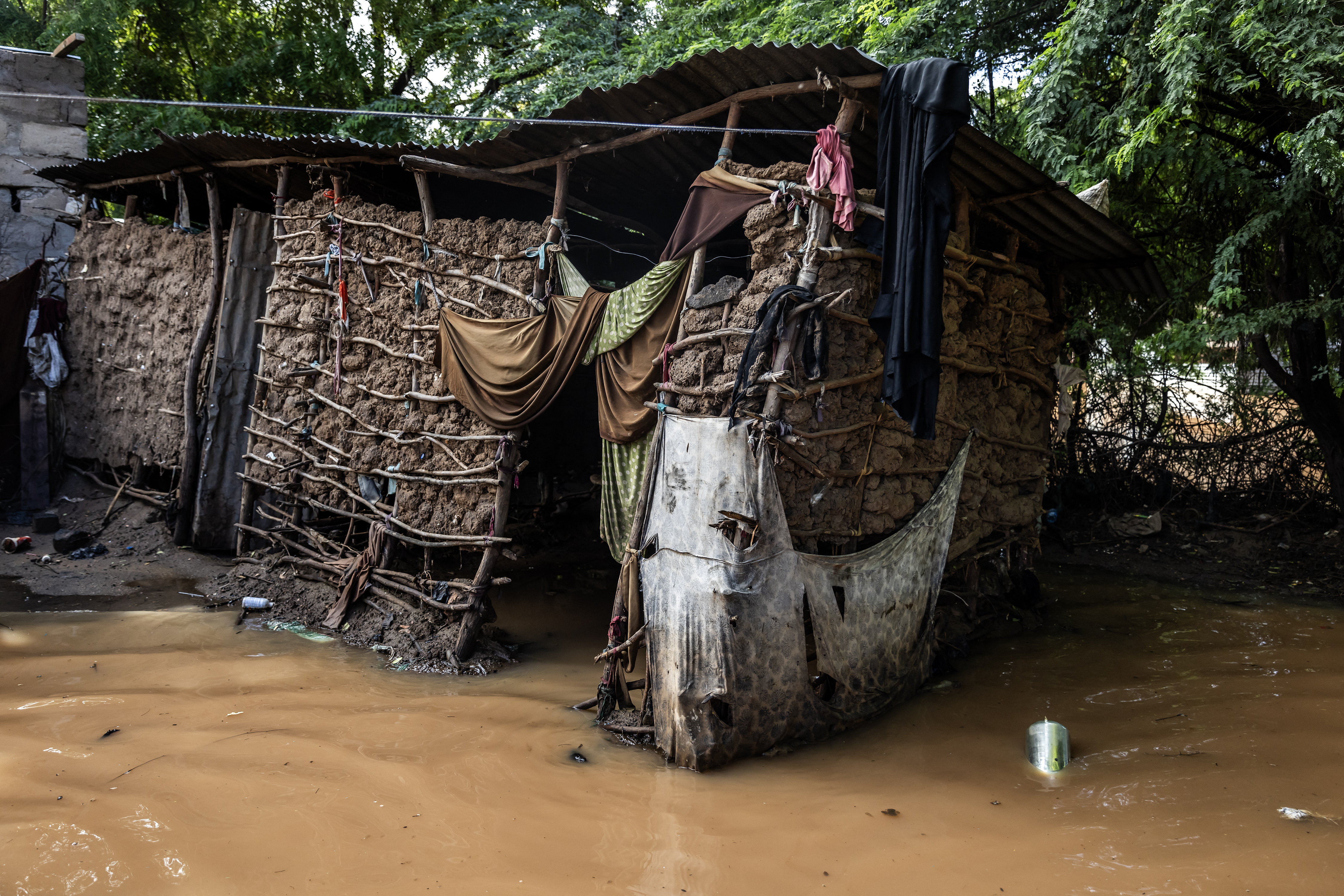 Collapsing houses are seen surrounded by water following flash floods in Garissa.
