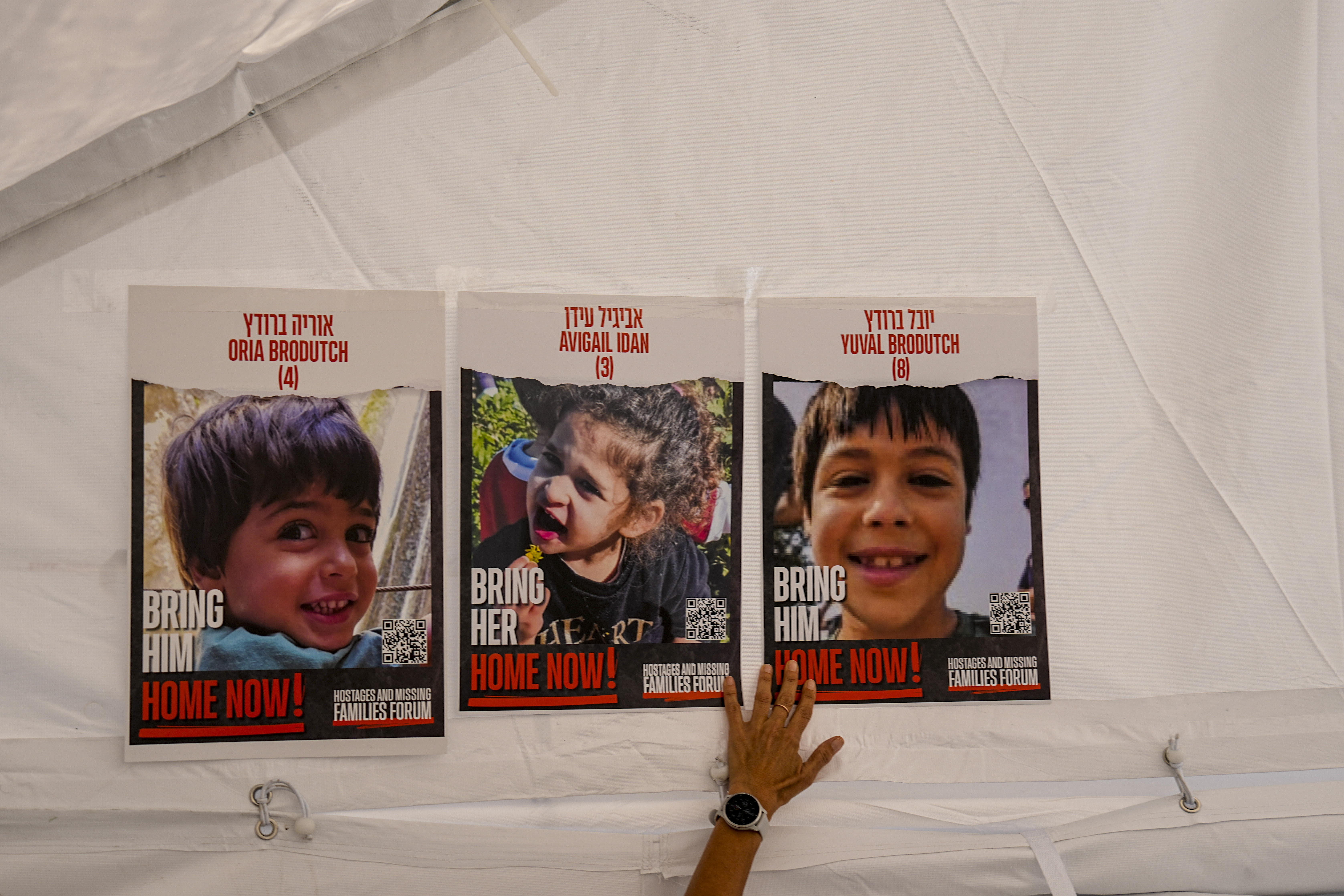 Posters showing three children being held captive by Hamas in Gaza
