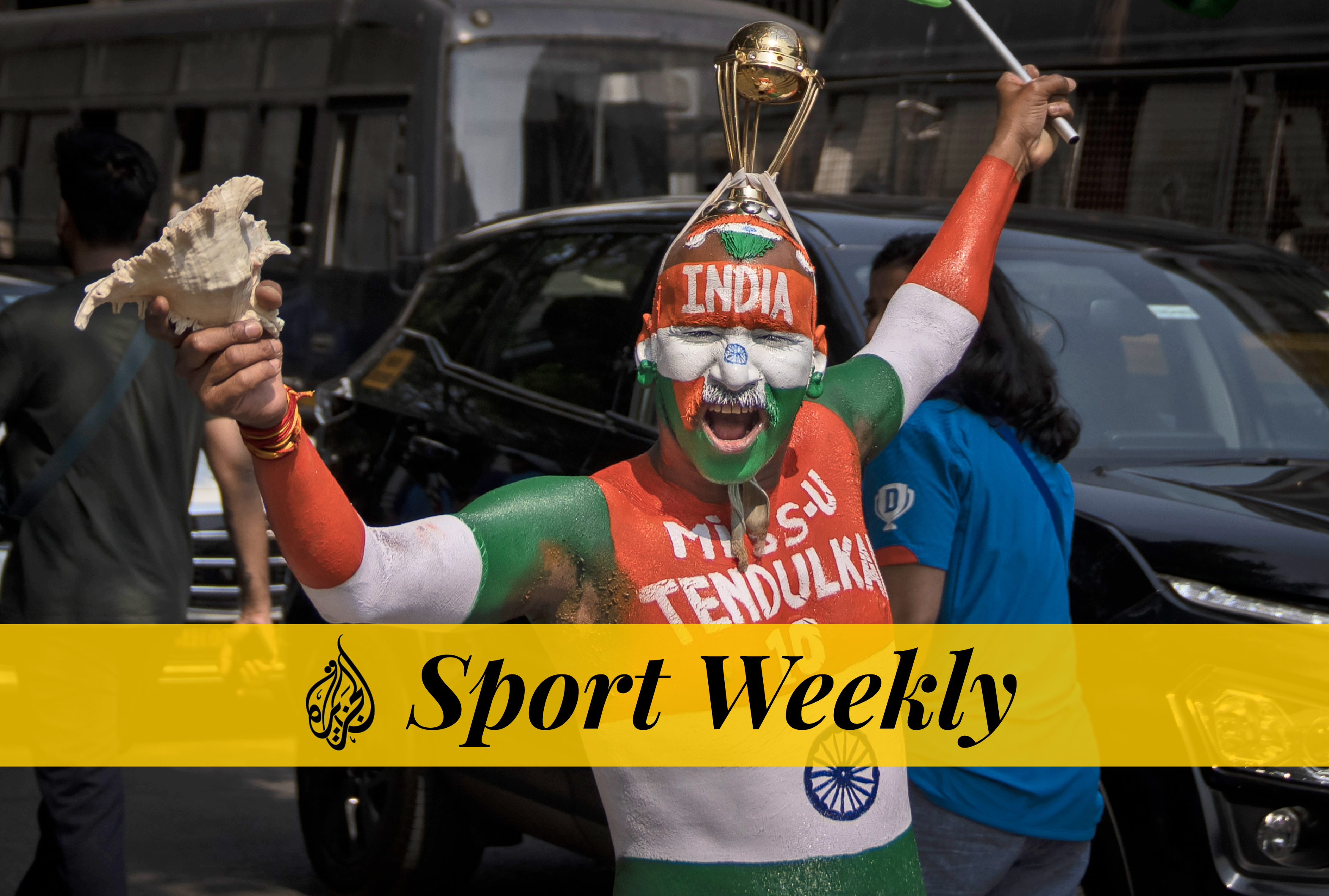 An Indian fan has his face painted with his country's flag as he waits to enter the stadium to watch the ICC Cricket World Cup semi-final match between India and New Zealand in Mumbai