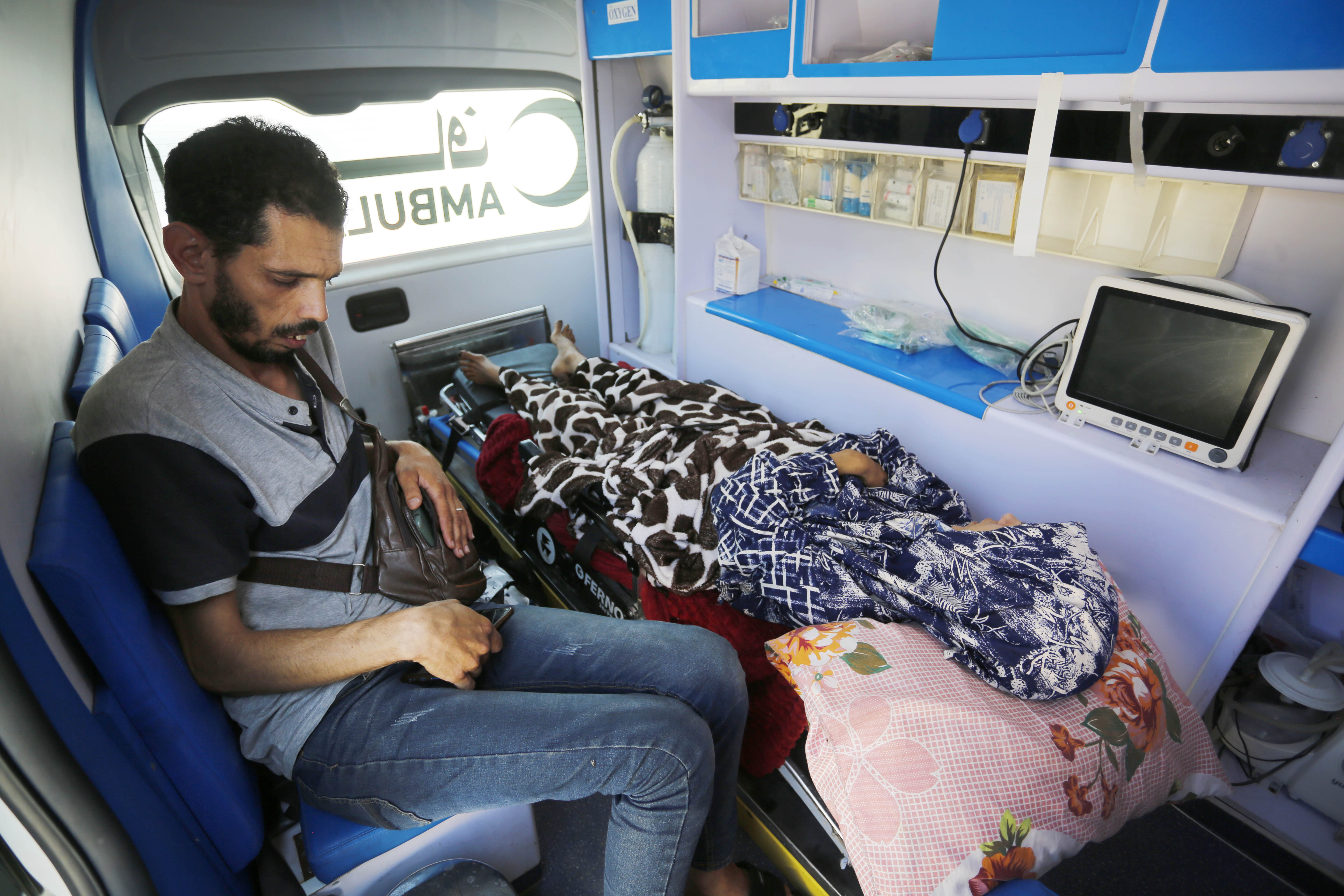 Marwa al-Qarra, who is accompanied by her husband, has intestinal bleeding, a broken pelvis, and a fractured back after she was crushed by rubble due to an Israeli air attack on Rafah 