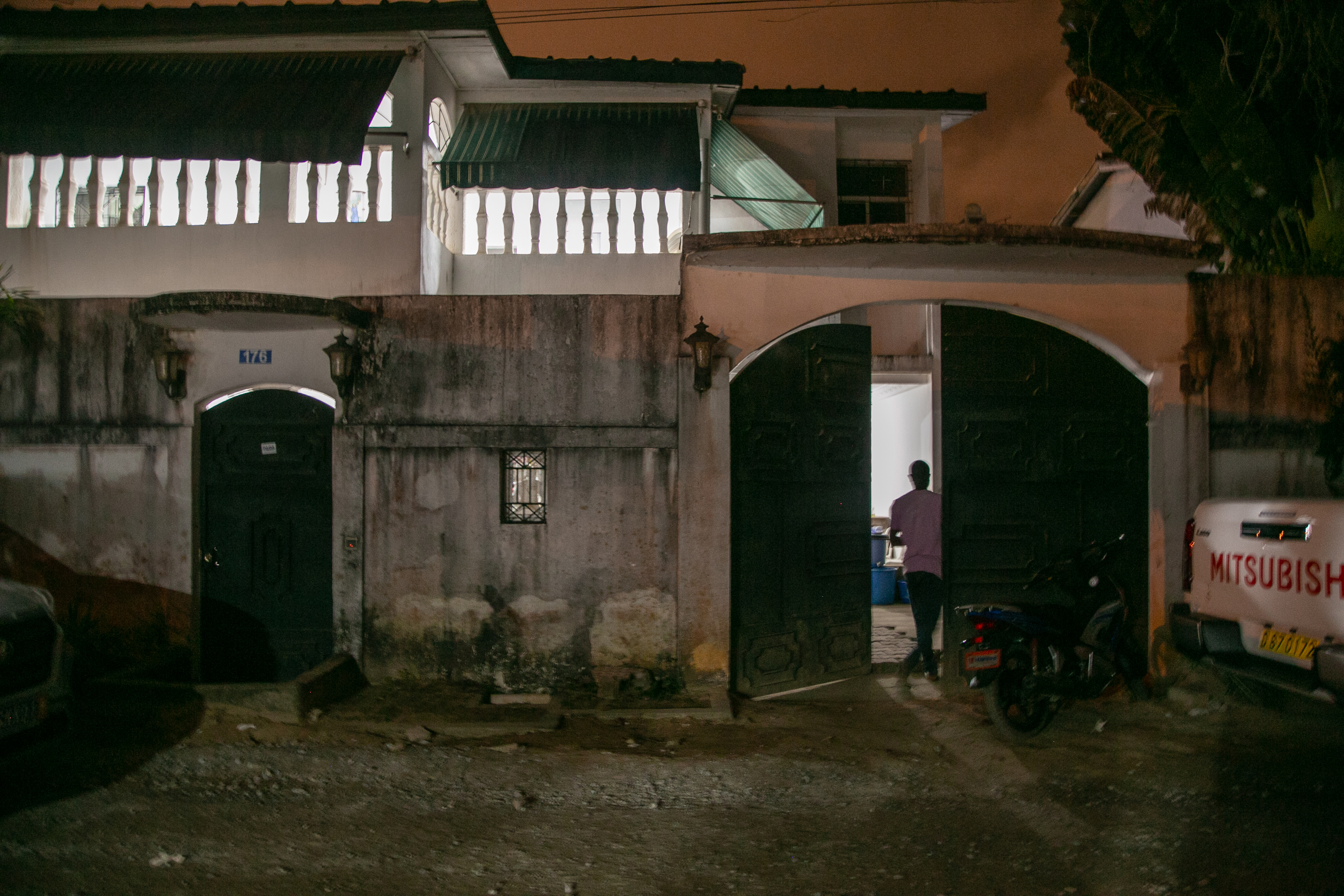 A man stands at the entrance of the Kol-Yehuda Synagogue