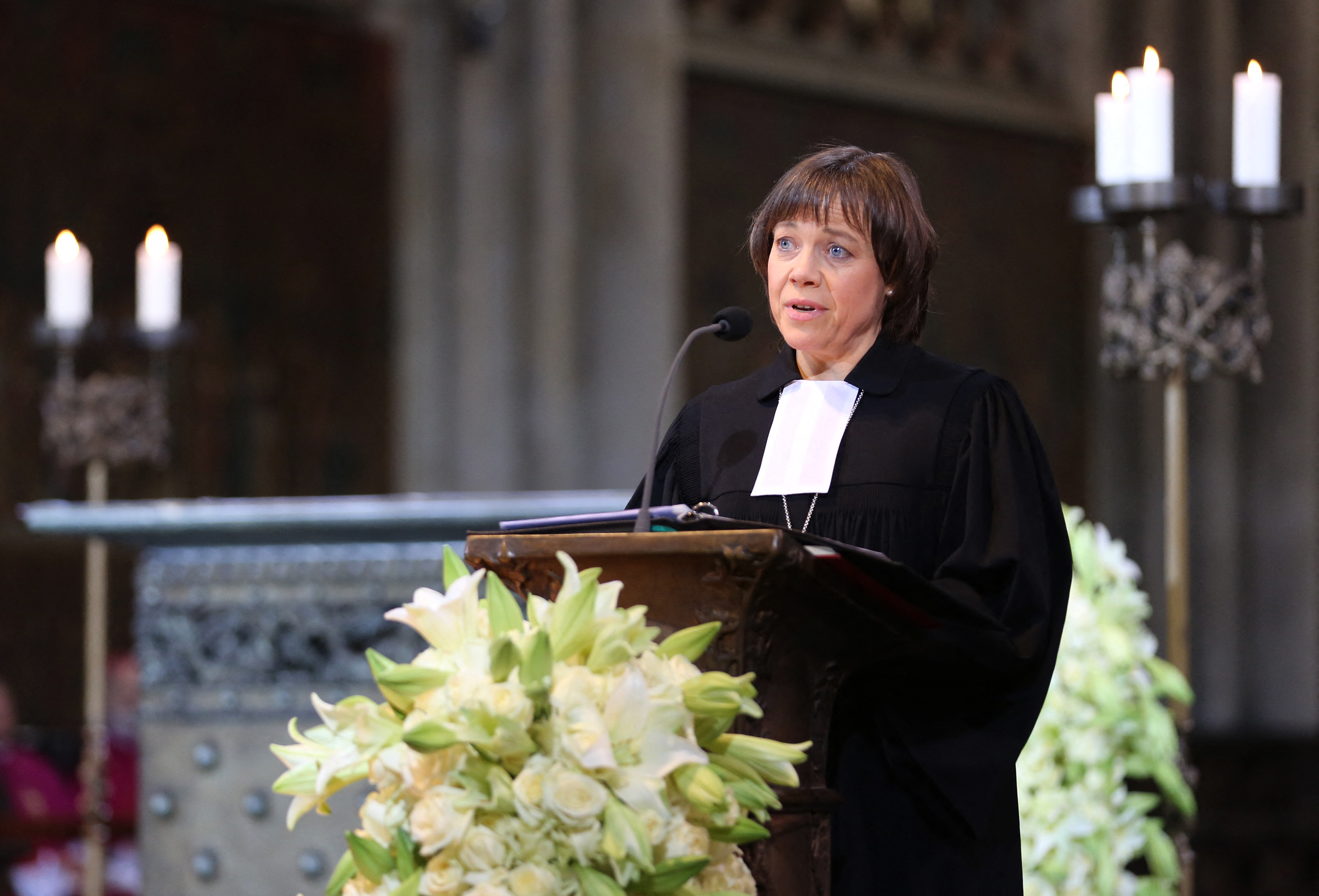 Annette Kurschus, leader of the Evangelical Church in Germany addresses a memorial service for the 150 people killed in the Germanwings plane crash in the Cathedral in Cologne, western Germany on April 17, 2015. About 1,400 mourners attend the service, among them 500 relatives of the victims, in northern Europe's largest Gothic church, which will also be broadcast live on screens outside the cathedral and to viewers nationwide. AFP PHOTO / POOL / OLIVER BERG (Photo by OLIVER BERG / POOL / AFP)