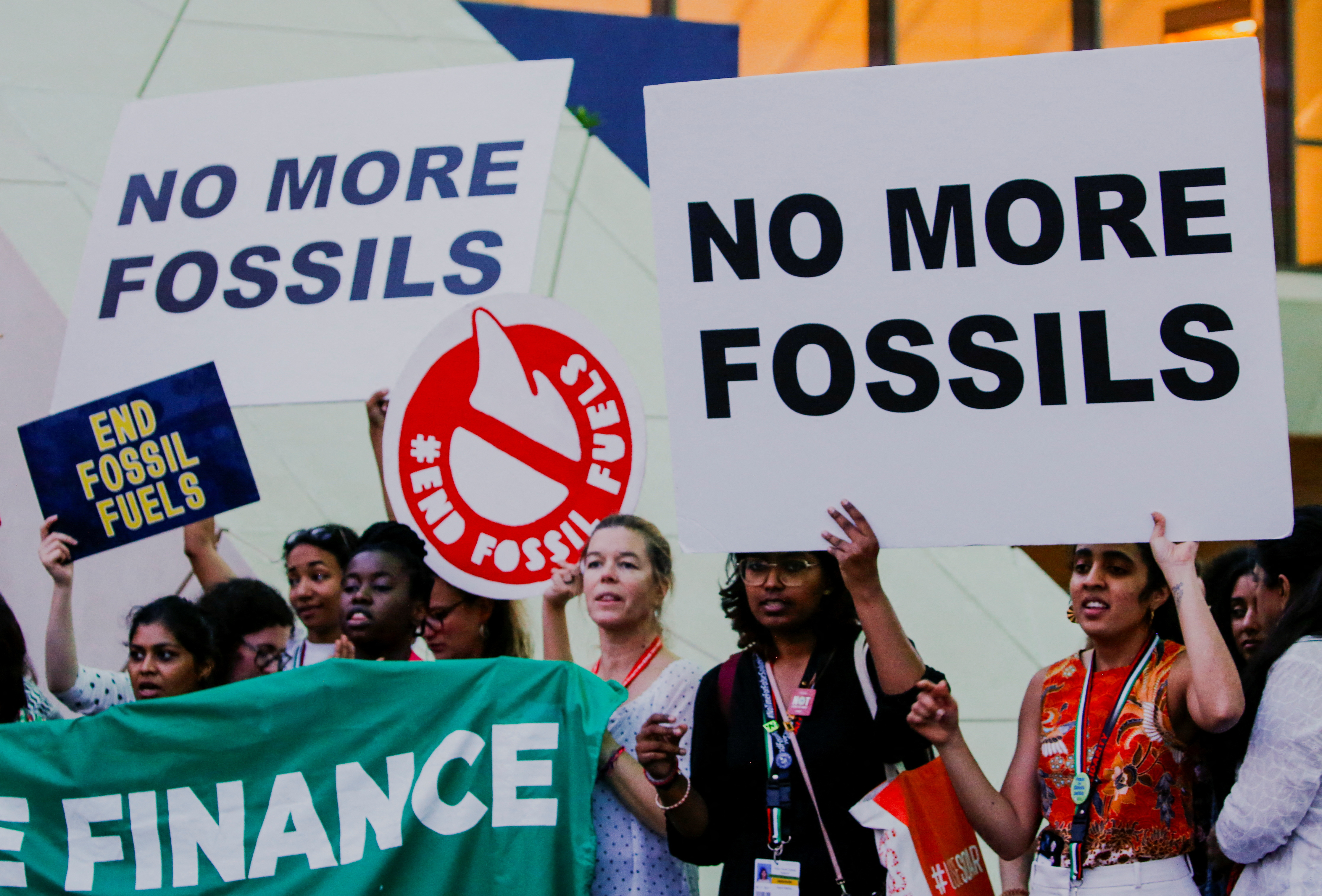 Climate activists protest against fossil fuels at Dubai's Expo City during the United Nations Climate Change Conference COP28