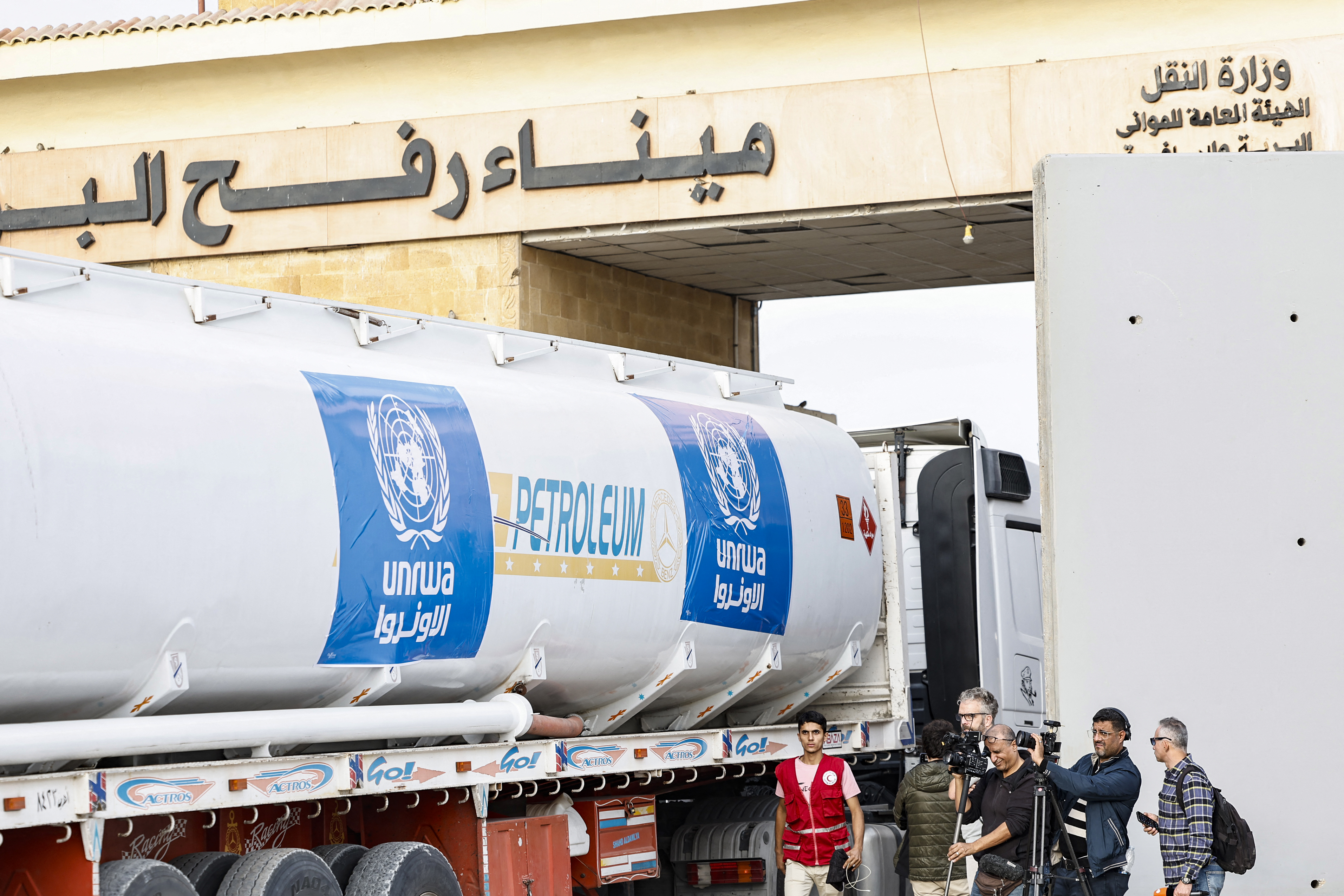 A truck carrying humanitarian aid from the UNRWA arrives at the Egyptian side of the Rafah border crossing with the Gaza Strip