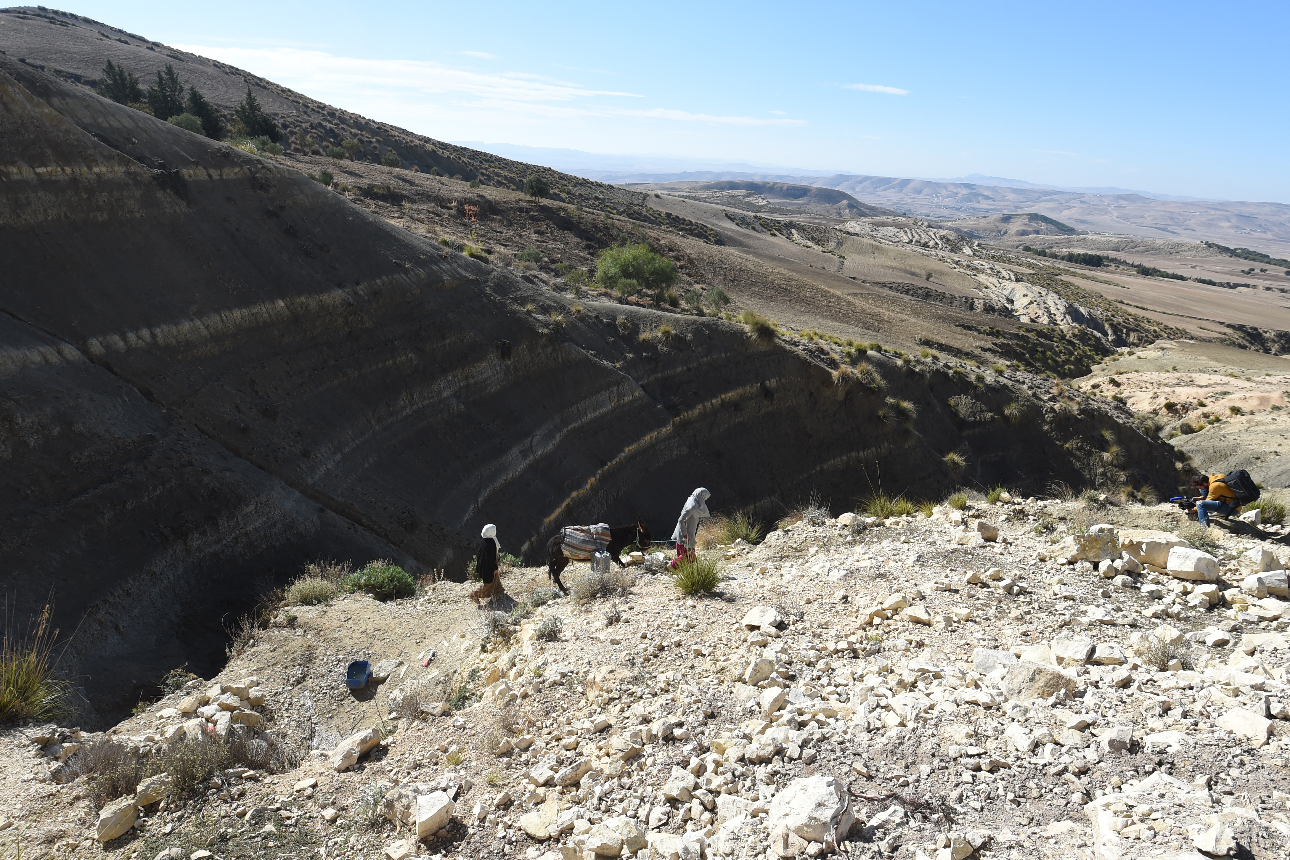 A Tunisian farmer transports water she filled up from a river on the back of a donkey in the remote village of Ouled Omar, 180 kilometres southwest of the capital Tunis.