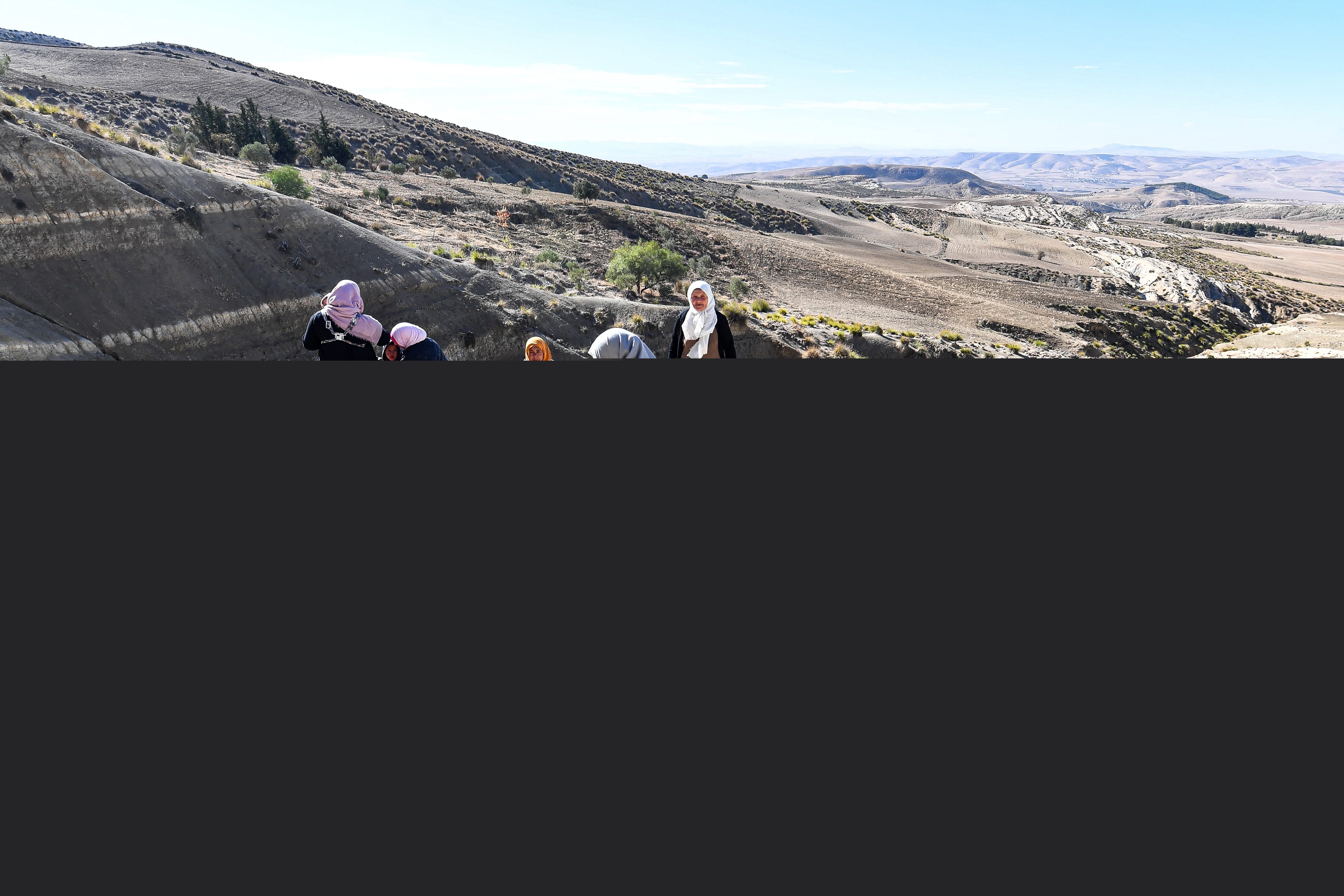 A Tunisian farmer transports water she filled up from a river on the back of a donkey in the remote village of Ouled Omar, 180 kilometres southwest of the capital Tunis.