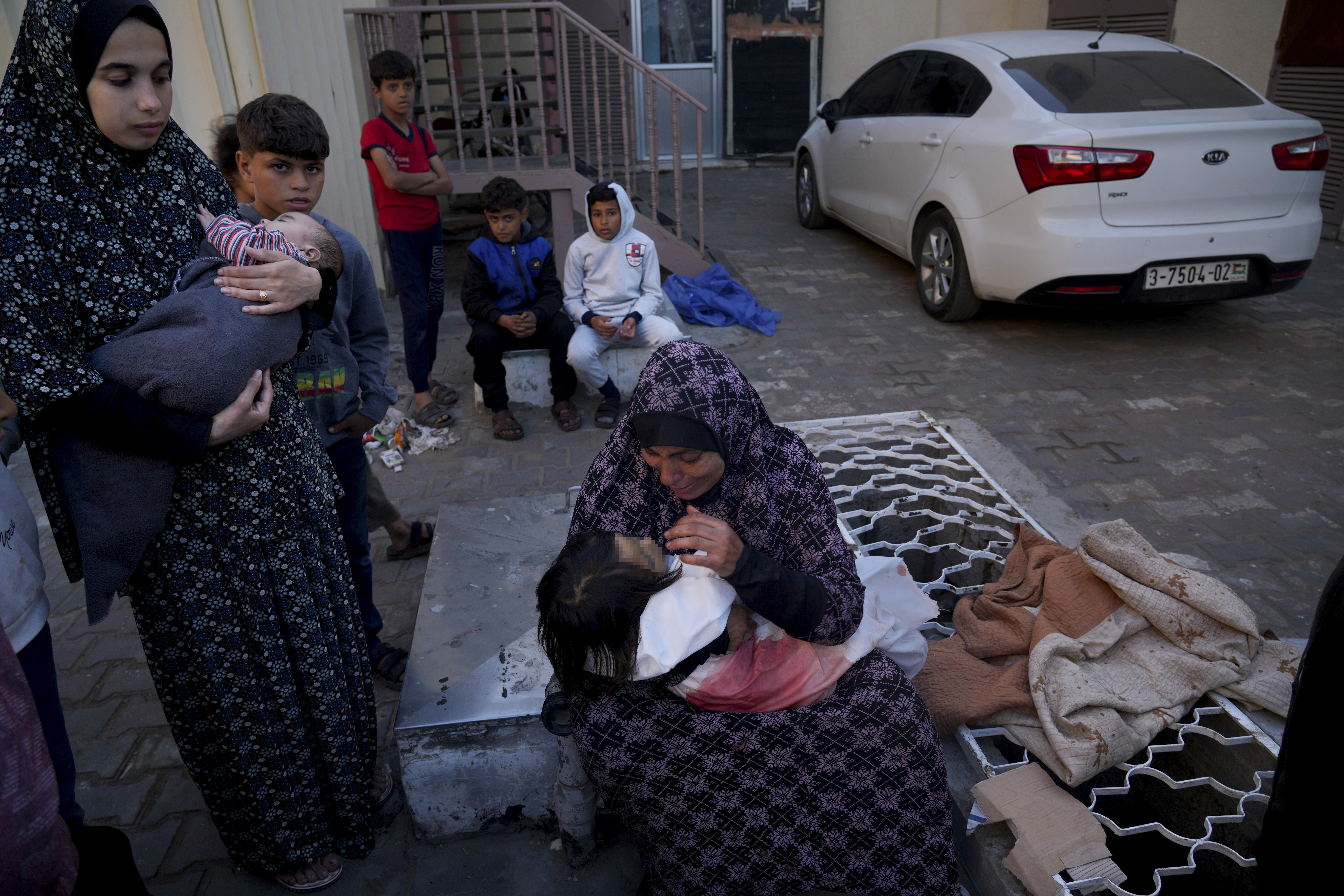 A mother cries for her daughter who was killed in the Israeli bombardment of the Gaza Strip al in Deir al Balah on Saturday.