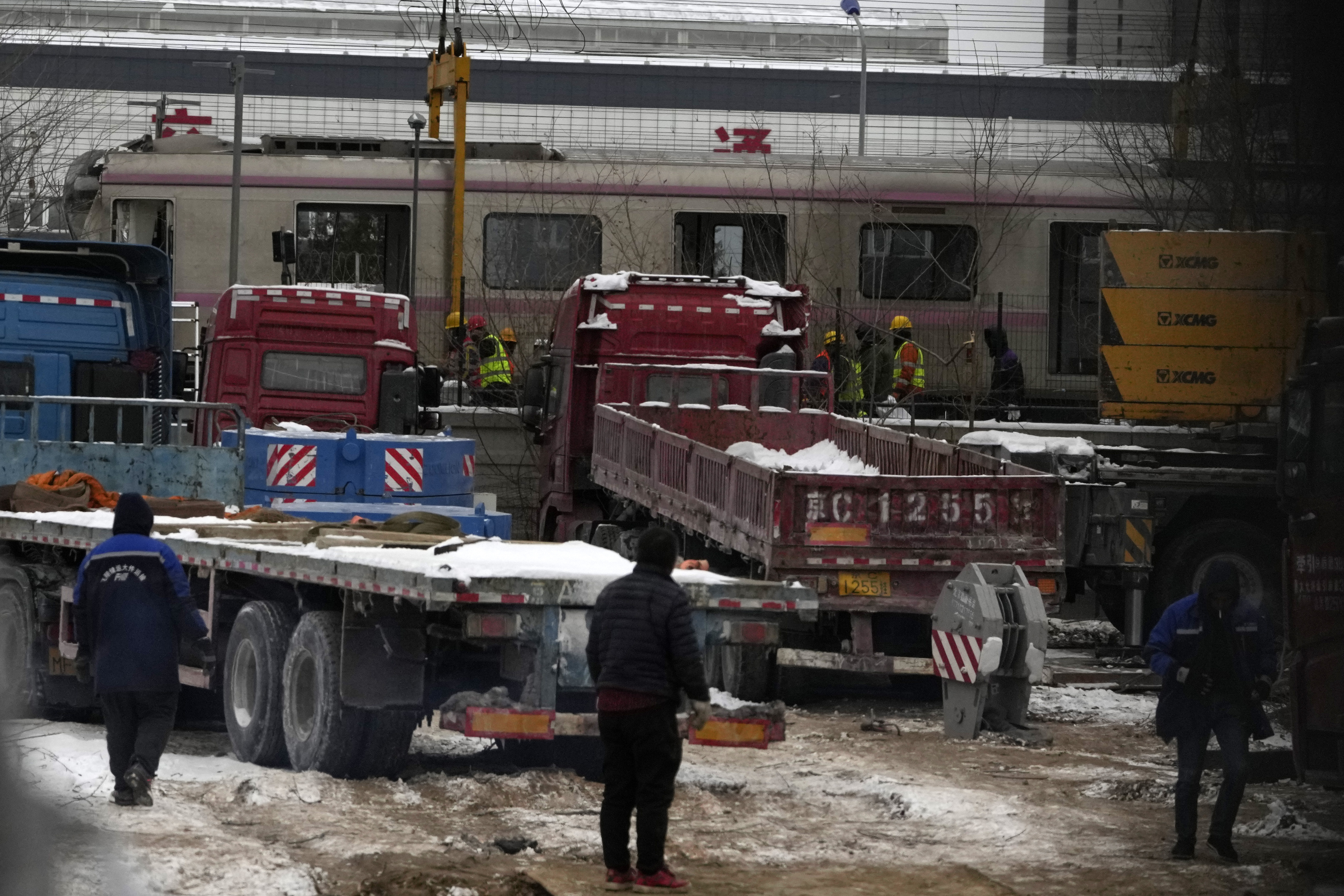 Police officers watch over near the site of train collision