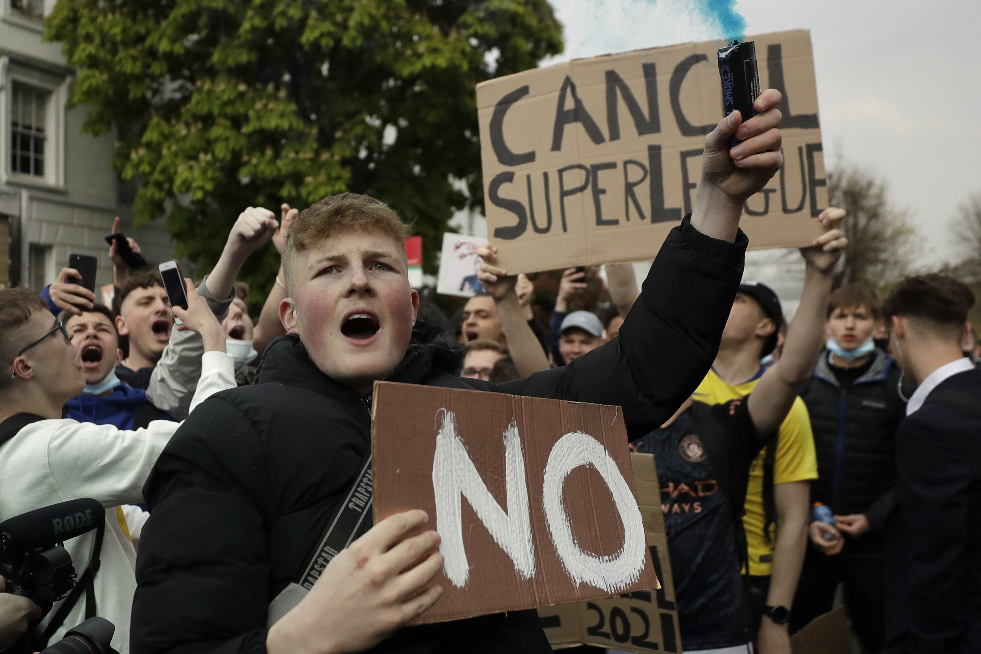 Chelsea fans protest outside Stamford Bridge stadium in London, against Chelsea's then decision to be included amongst the clubs attempting to form a new European Super League, Tuesday, April 20, 2021. [AP Photo/Matt Dunham, File]