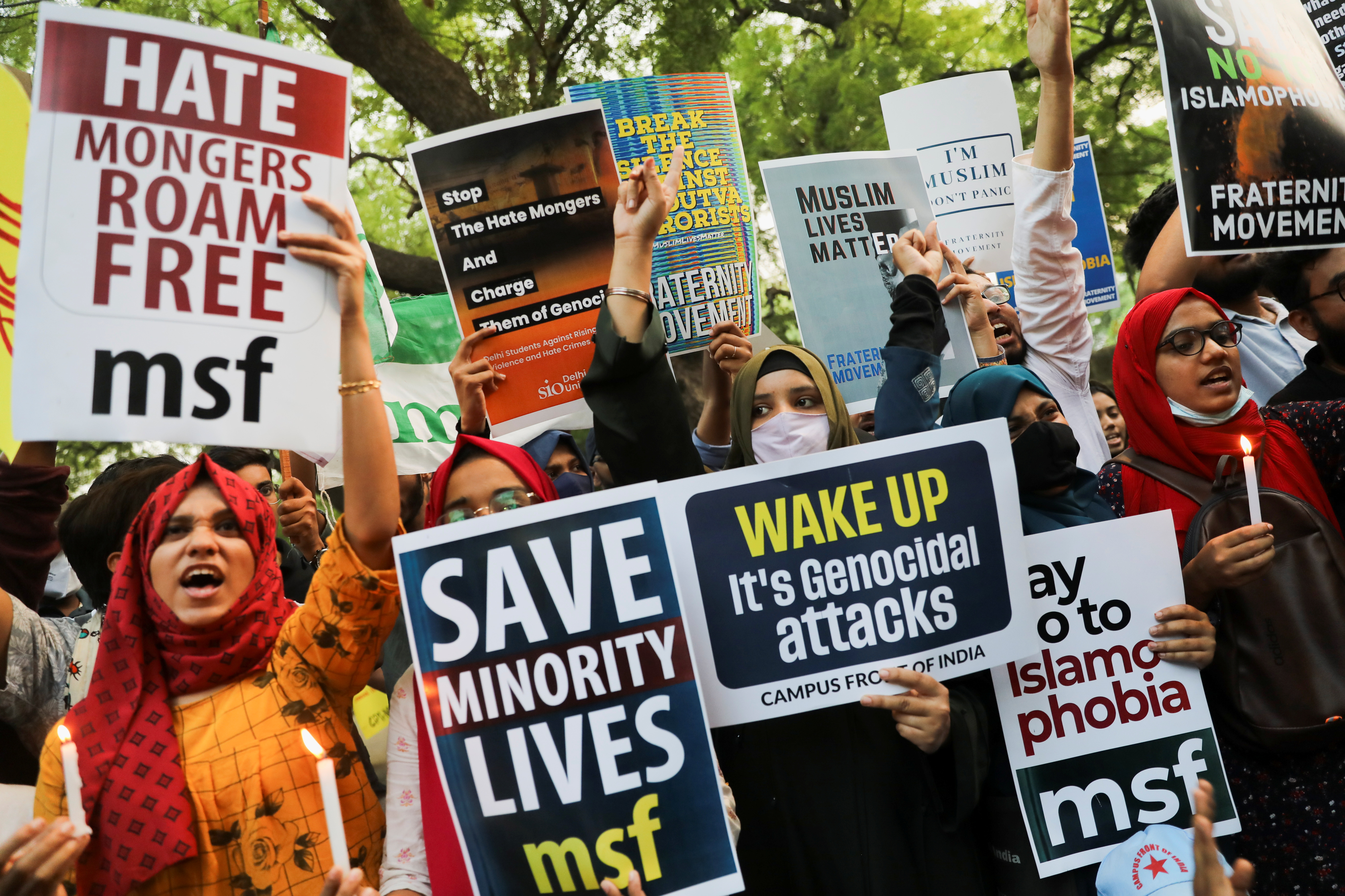 Citizens shout slogans and hold placards during a peace vigil organised by citizens against what they say is rise in hate crimes and violence against Muslims in the country, in New Delhi, India, April 16, 2022. REUTERS/Anushree Fadnavis