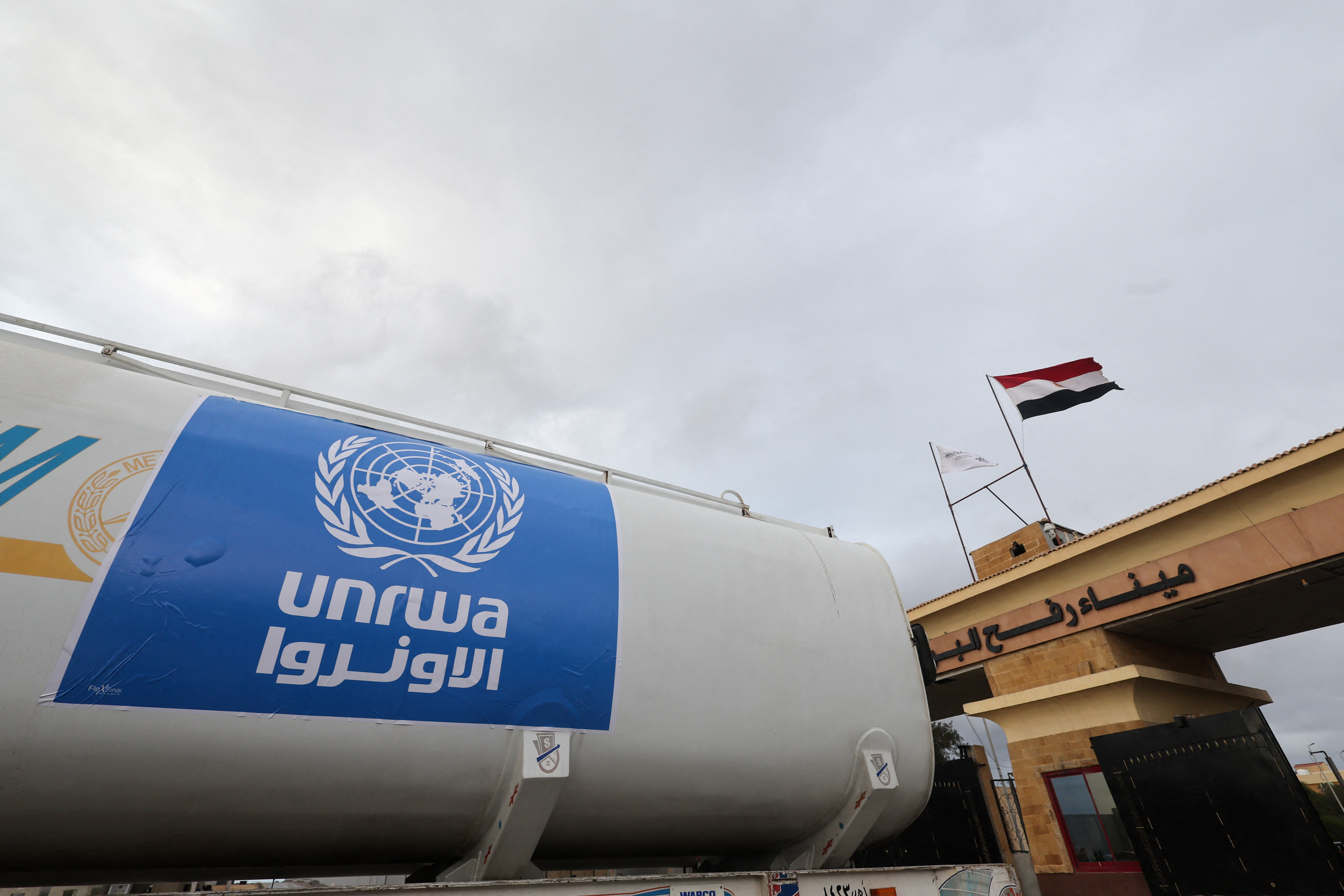 A truck, marked with United Nations Relief and Works Agency (UNRWA) logo, crosses into Egypt from Gaza, at the Rafah border crossing between Egypt and the Gaza Strip, during a temporary truce between Hamas and Israel, in Rafah, Egypt, November 27, 2023. REUTERS/Amr Abdallah Dalsh