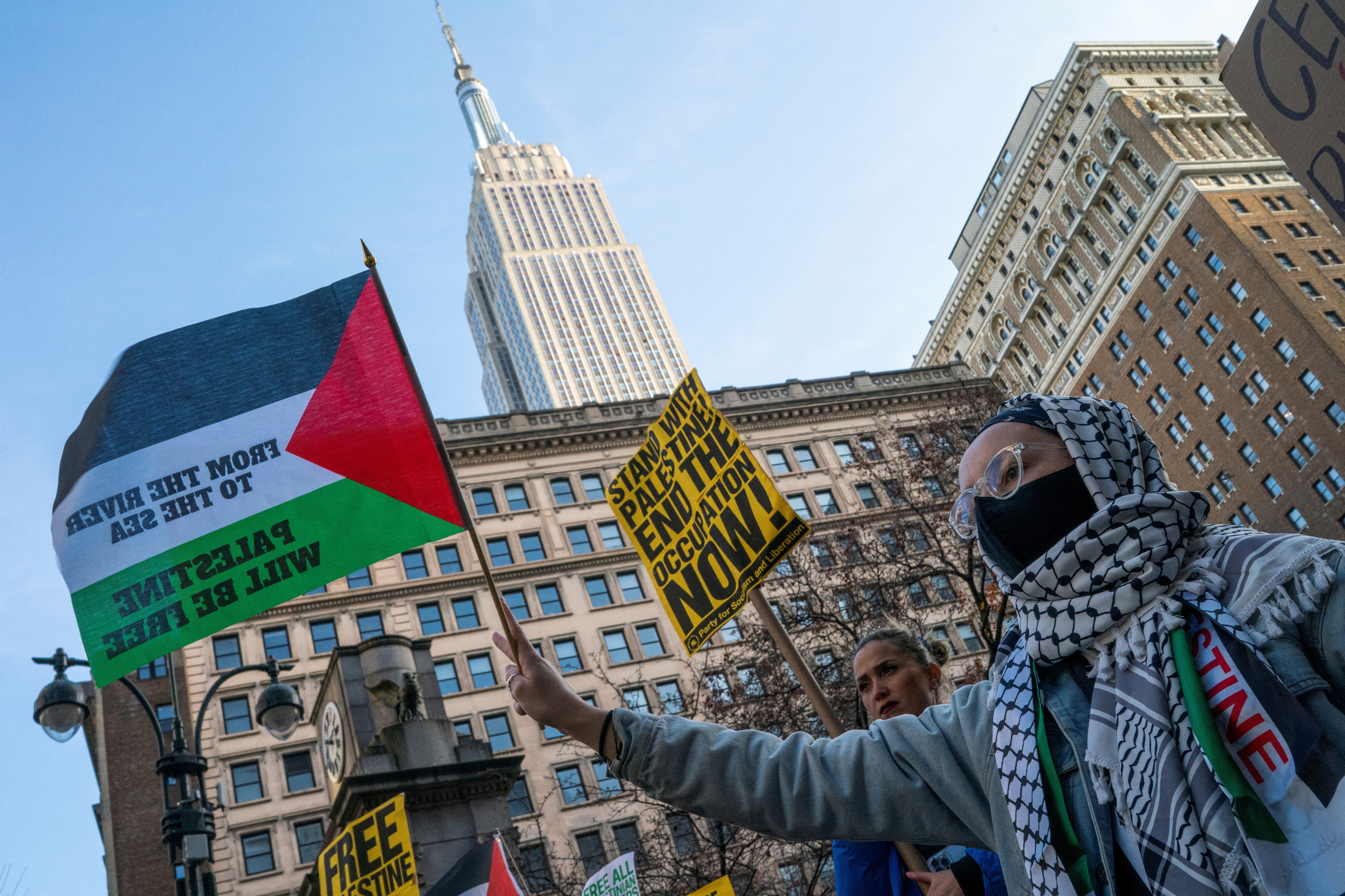 Pro-Palestinian demonstrators march around Herald Square as they take part in the 'Shut it Down for Palestine' protests in New York City, U.S., December 16, 2023