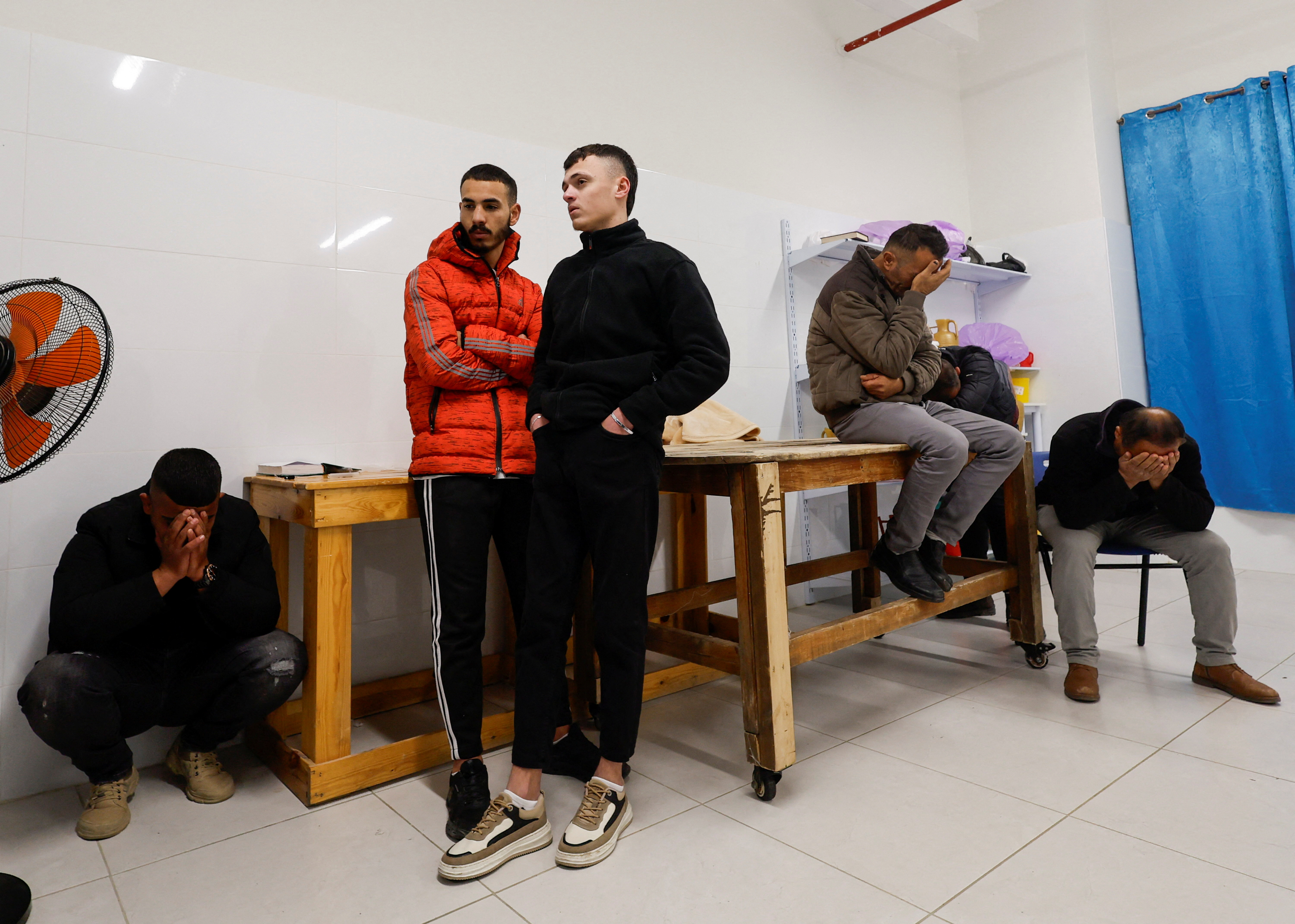 Relatives react near the body of 22-year old Palestinian Mohammed Abu Sba'a who was killed by Israeli troops, in a Hospital in Dura near Hebron