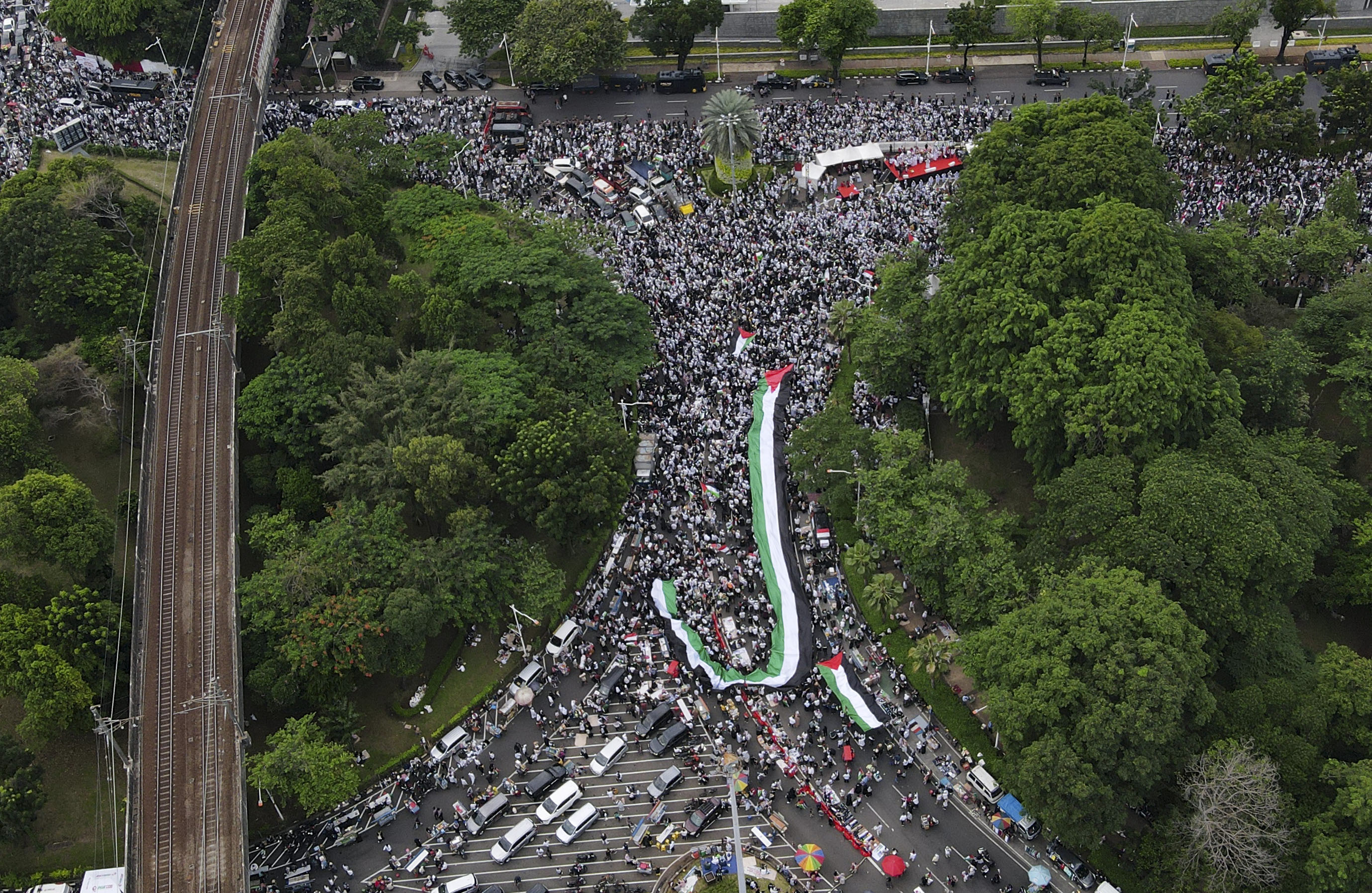 An aerial view of people took action to commemorate the 100th day of the Israeli attack on Gaza outside the United States Embassy, Jakarta, Indonesia on Saturday, January 13
