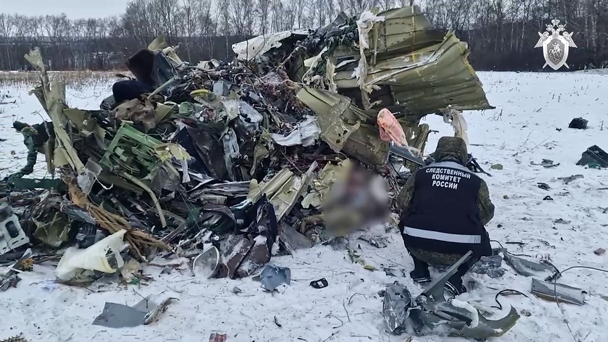 This grab taken from a handout footage released by the Russian Investigative Committee on January 25, 2024 shows what investigators say is the Russian IL-76 military transport plane crash site in the Belgorod region. - Russia on January 25, 2024 opened a "terrorism" investigation over a military plane crash near the border with Ukraine after it accused Kyiv of downing the aircraft, which it said had 65 captured Ukrainian soldiers onboard. (Photo by Handout / RUSSIAN INVESTIGATIVE COMMITTEE / AFP) / RESTRICTED TO EDITORIAL USE - MANDATORY CREDIT "AFP PHOTO / RUSSIAN INVESTIGATIVE COMMITTEE" - NO MARKETING NO ADVERTISING CAMPAIGNS - DISTRIBUTED AS A SERVICE TO CLIENTS - RESTRICTED TO EDITORIAL USE - MANDATORY CREDIT "AFP PHOTO / Russian Investigative Committee" - NO MARKETING NO ADVERTISING CAMPAIGNS - DISTRIBUTED AS A SERVICE TO CLIENTS /