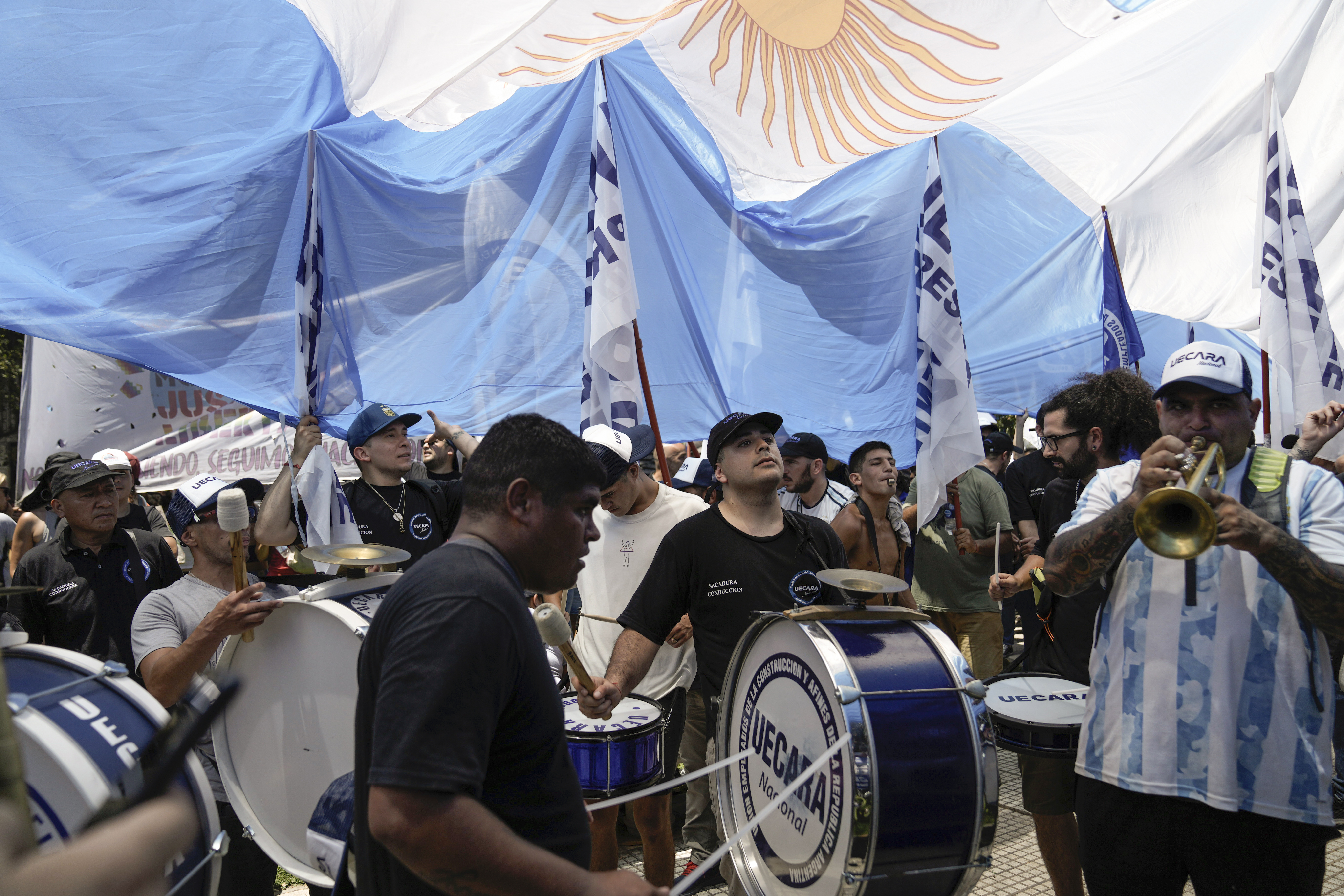 People march to Congress during a national strike