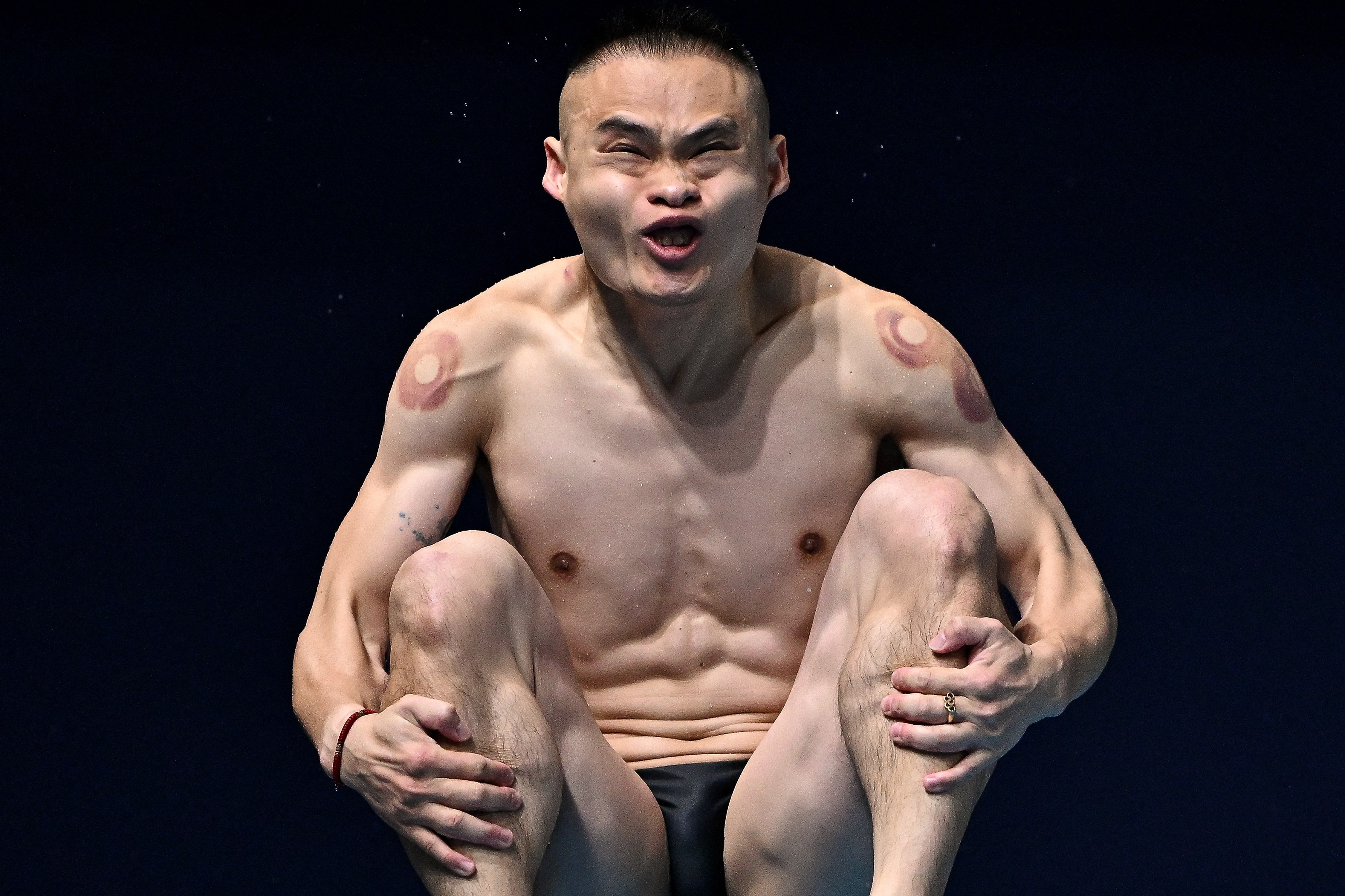 Australia's Shixin Li competes in the preliminary round of the men's 1m springboard diving event during the 2024 World Aquatics Championships at Hamad Aquatics Centre in Doha on February 3