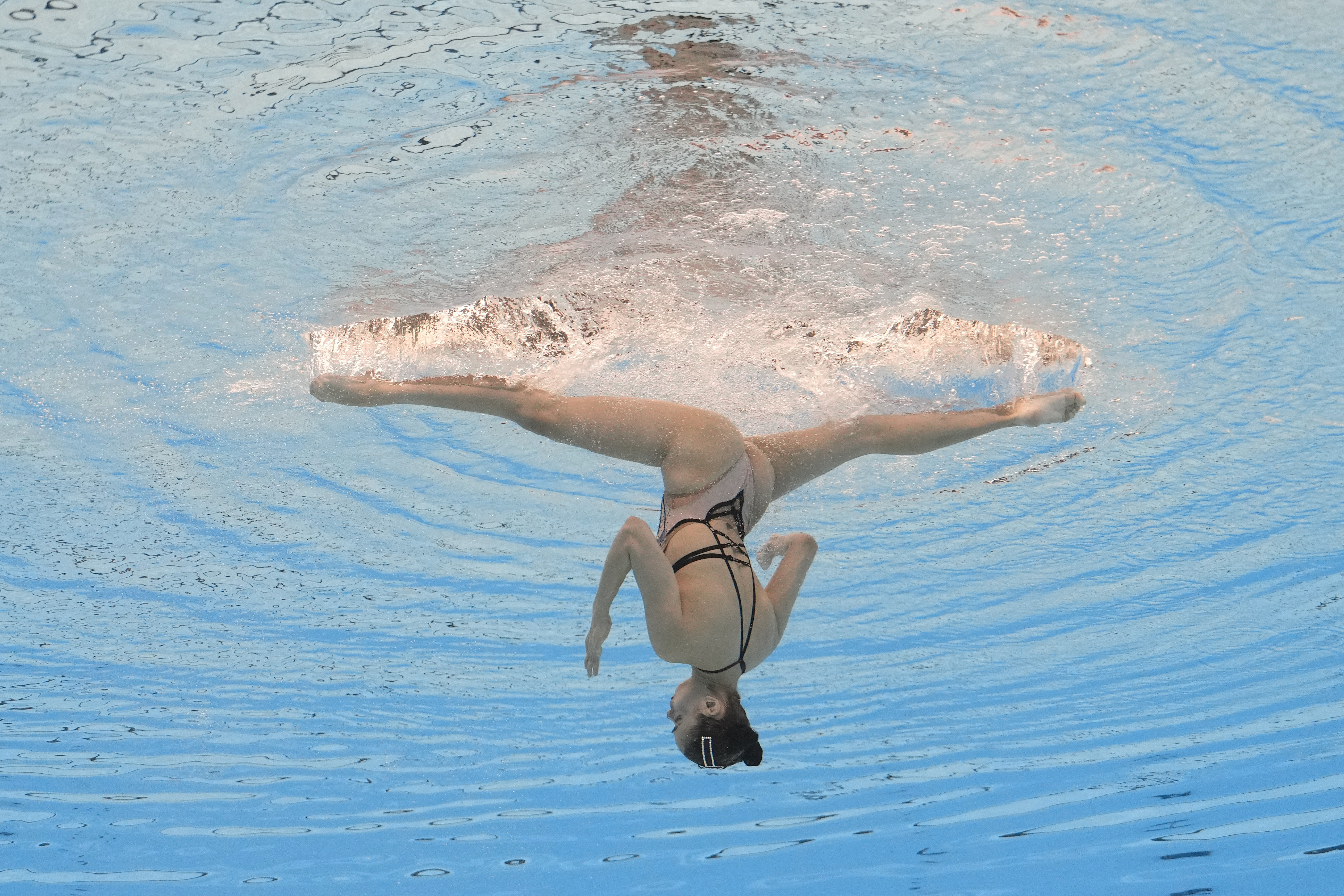Karina Magrupova of Kazakhstan competes in the women's solo free of artistic swimming at the World Aquatics Championships in Doha, Qatar, Sunday, Feb. 4