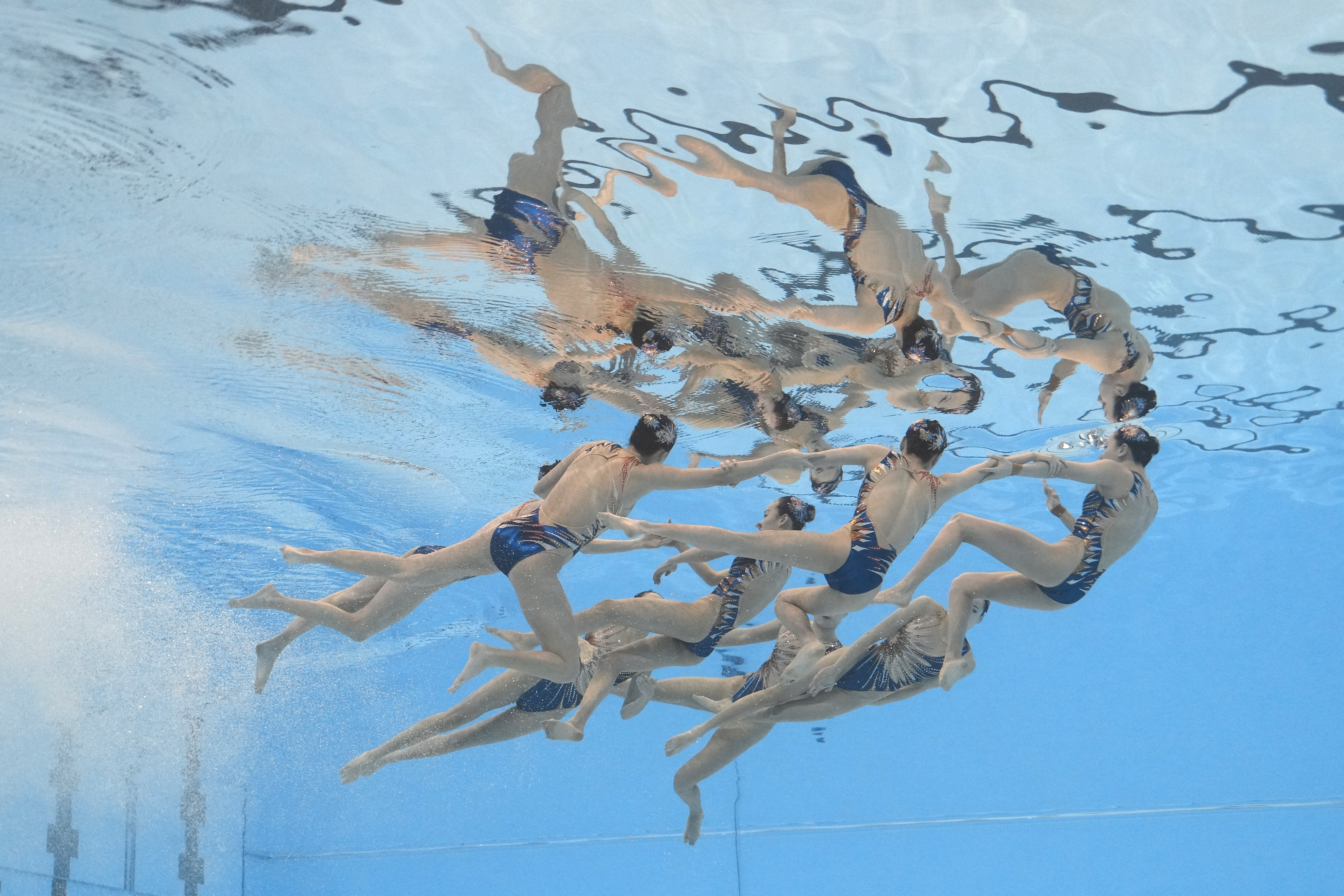 China team compete in the mixed team acrobatic final of artistic swimming at the World Aquatics Championships in Doha, Qatar, Sunday