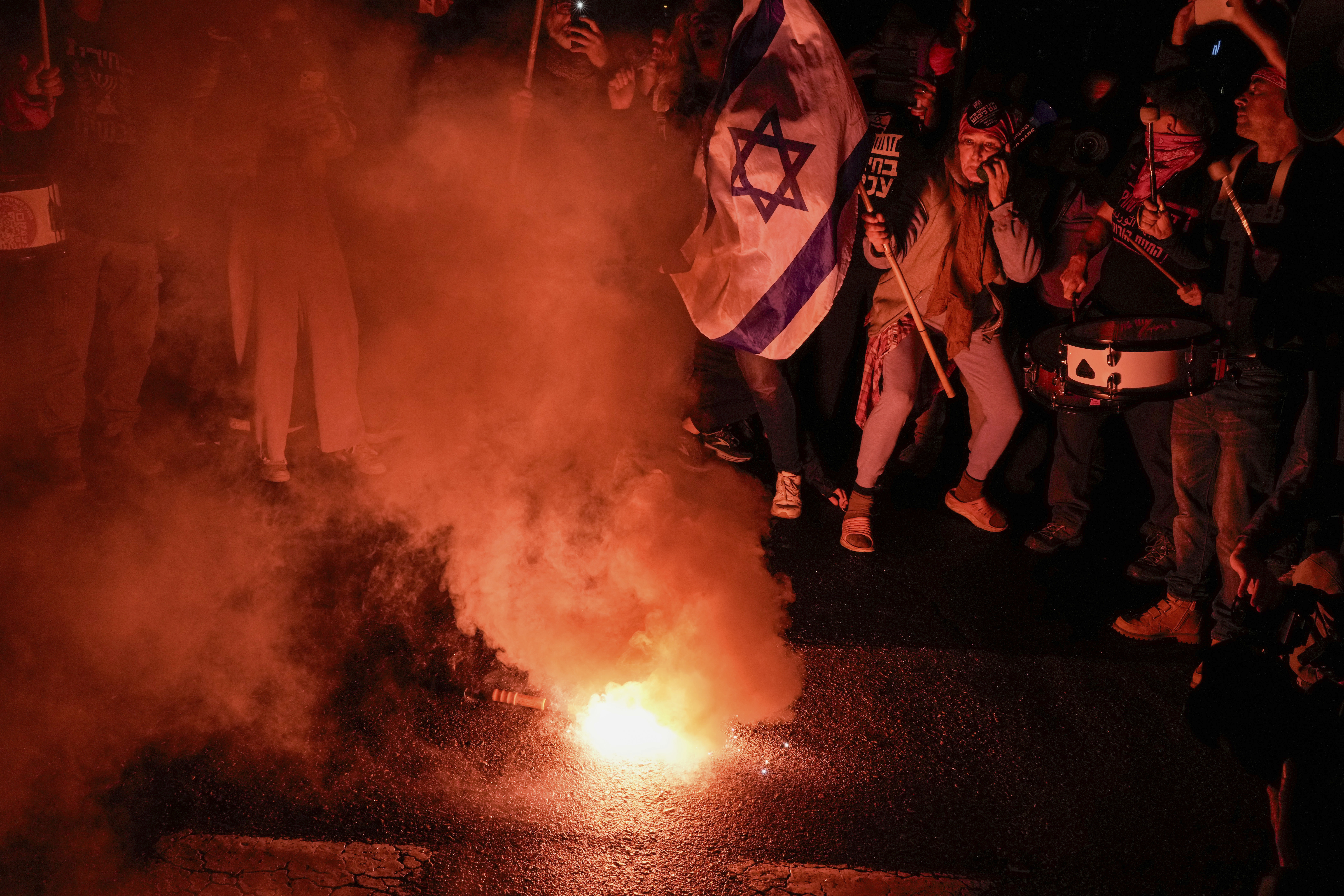 Demonstrators protest against Israeli Prime Minister Benjamin Netanyahu and call for new elections in the latest weekly protest against his handling of the Israel-Hamas war, in Tel Aviv, Israel, Saturday, Feb. 17, 2024.(AP Photo/Leo Correa)