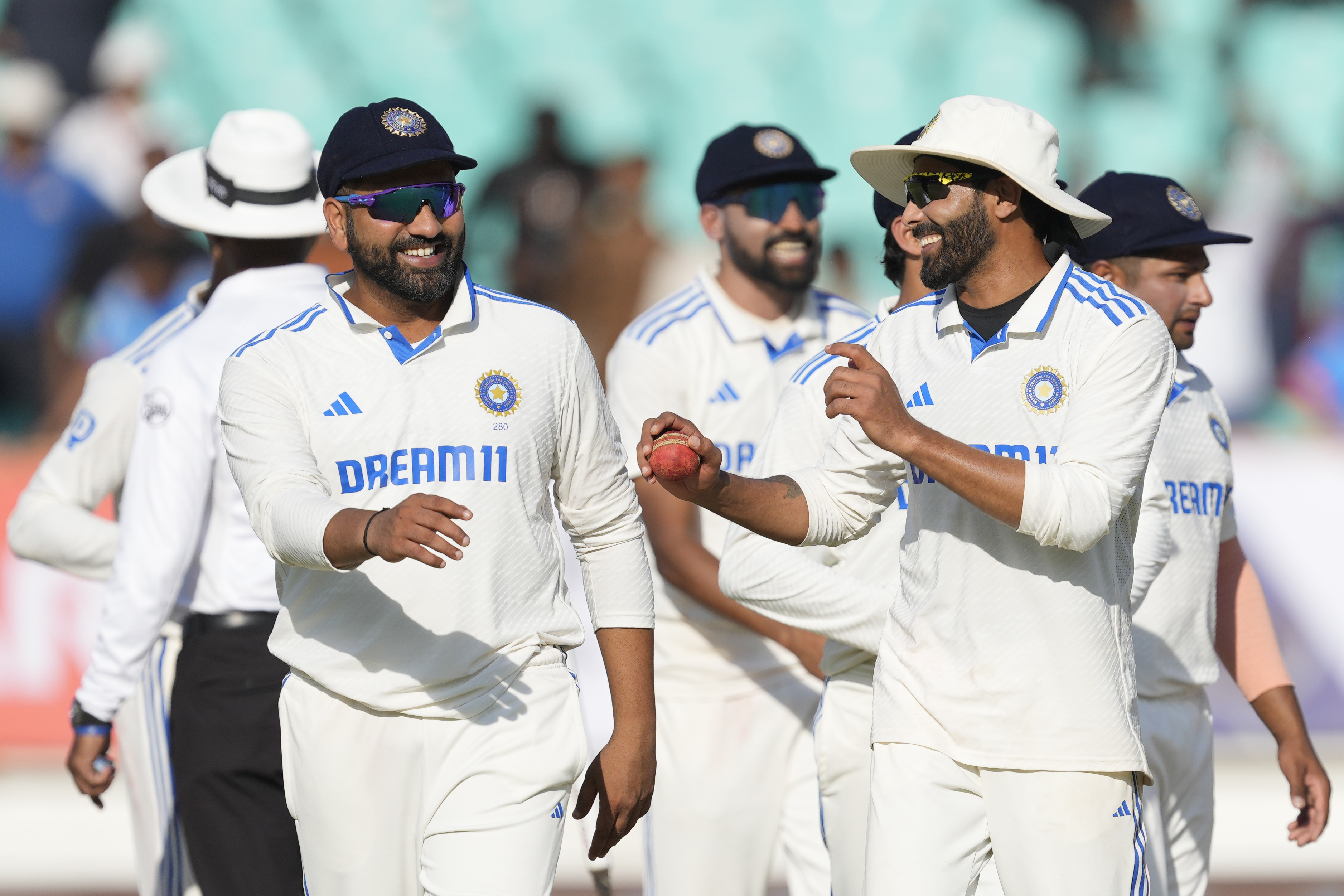 India's captain Rohit Sharma, left, and teammate Ravindra Jadeja celebrate