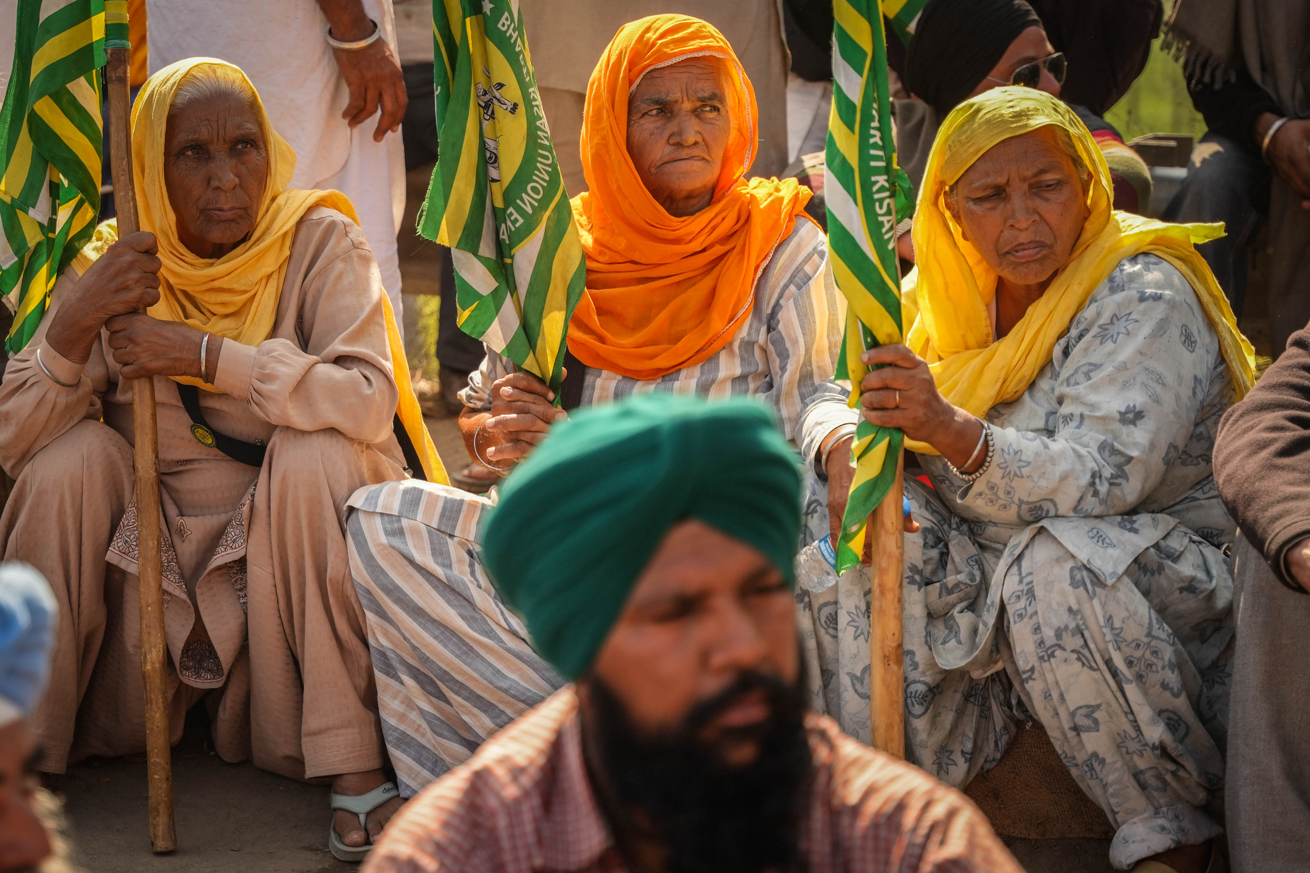 women farmers listening to a speech by a farmer leader at the protest site in Shambhu border [Md Meherban/Al Jazeera]