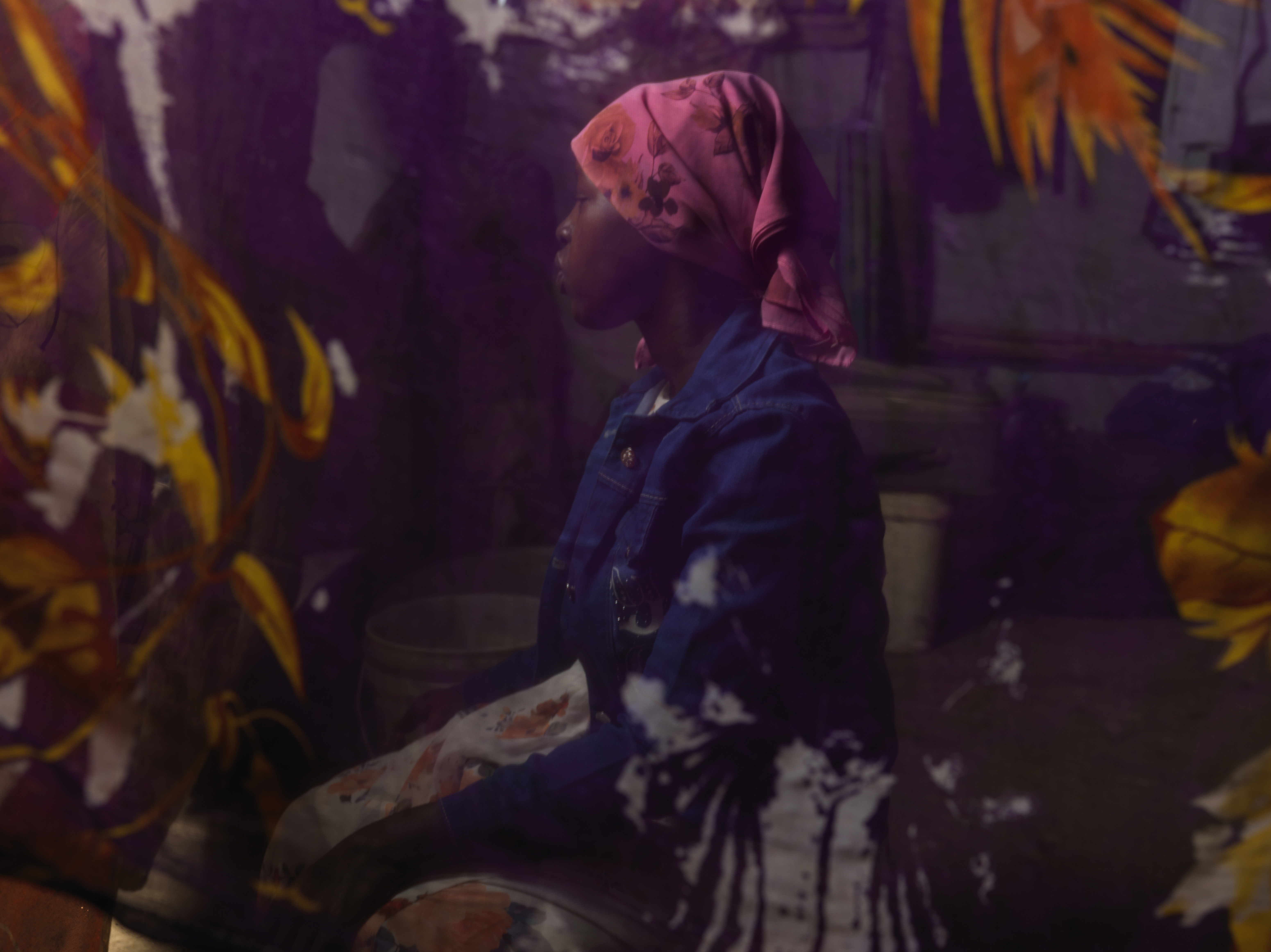 Portrait of Nyawich Mai, 20, at a shelter built by Plan International.