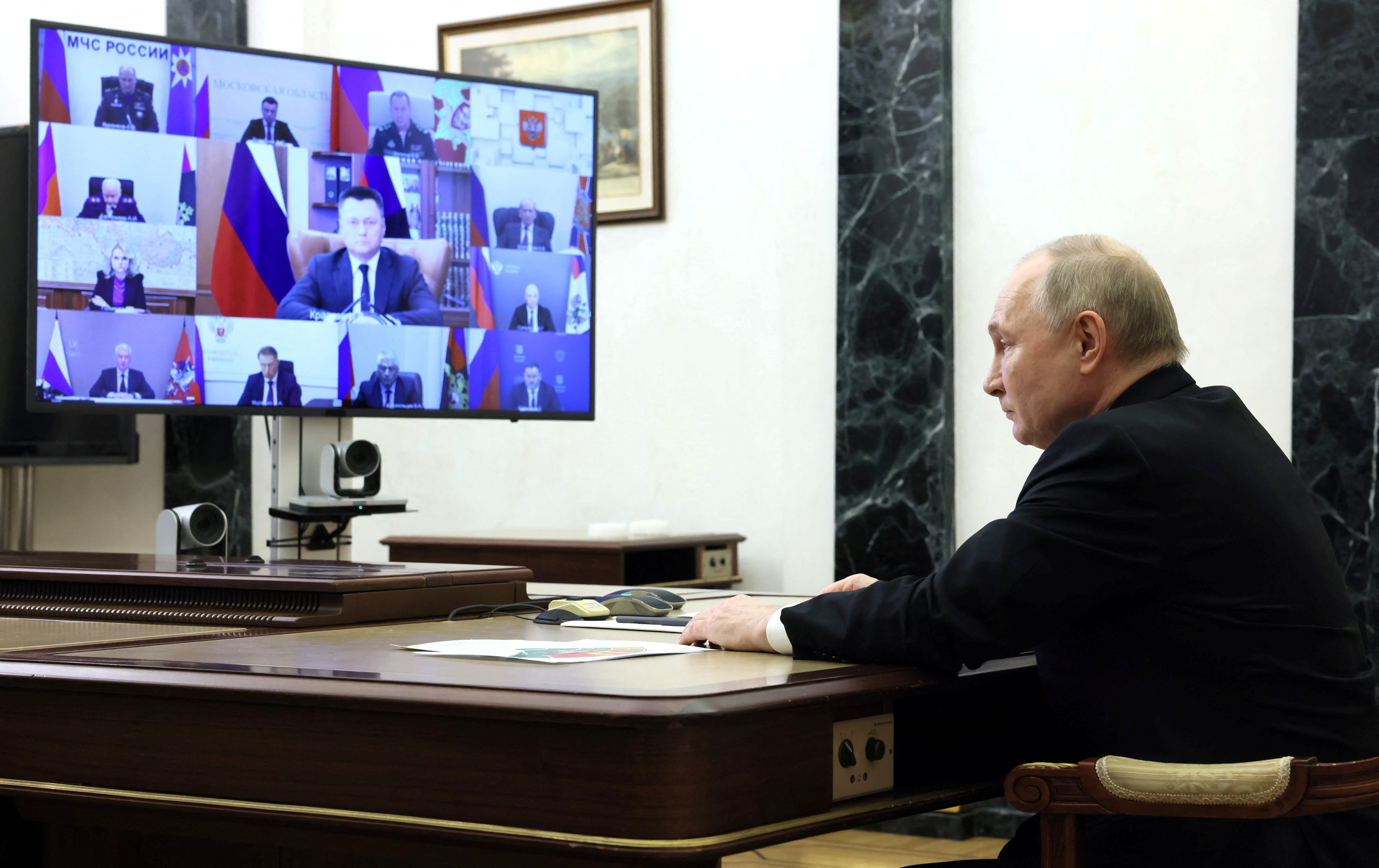 Russian President Vladimir Putin chairs a meeting, held to discuss aftermaths and measures taken after the attack on the Crocus City Hall concert venue, at a residence outside Moscow, Russia, March 25, 2024