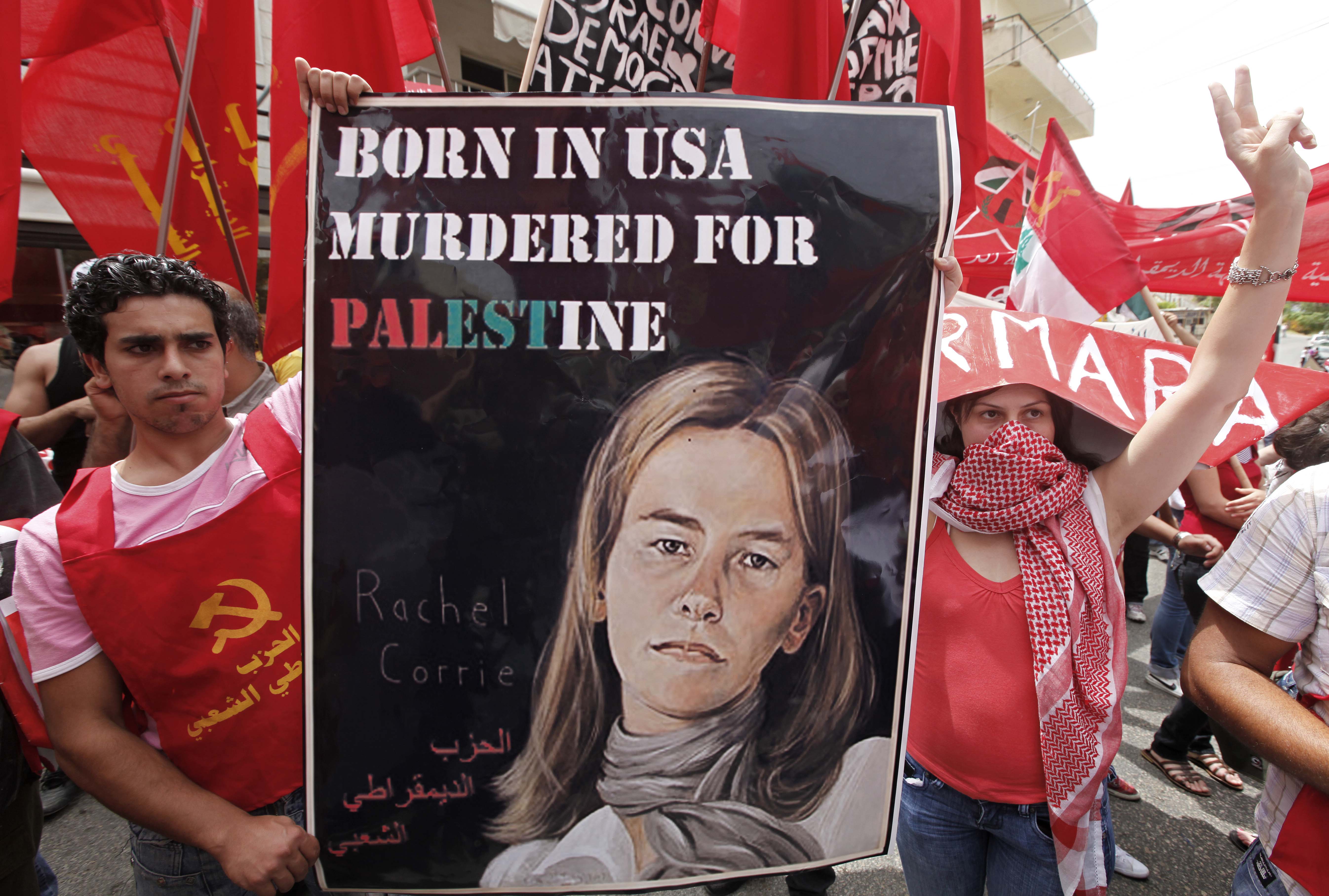 Lebanese anti-American protesters display a poster of peace activist Rachel Corrie during a demonstration near the U.S. Embassy in Aukar northeast of Beirut