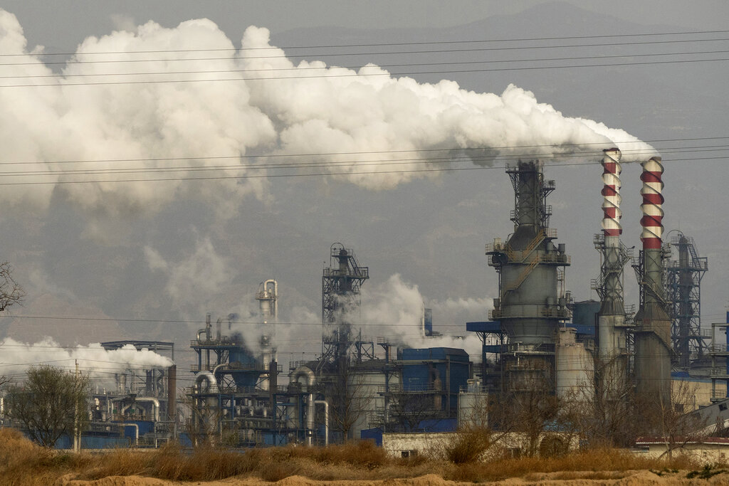 Smoke and steam rise from a coal processing plant in Hejin in central China's Shanxi Province