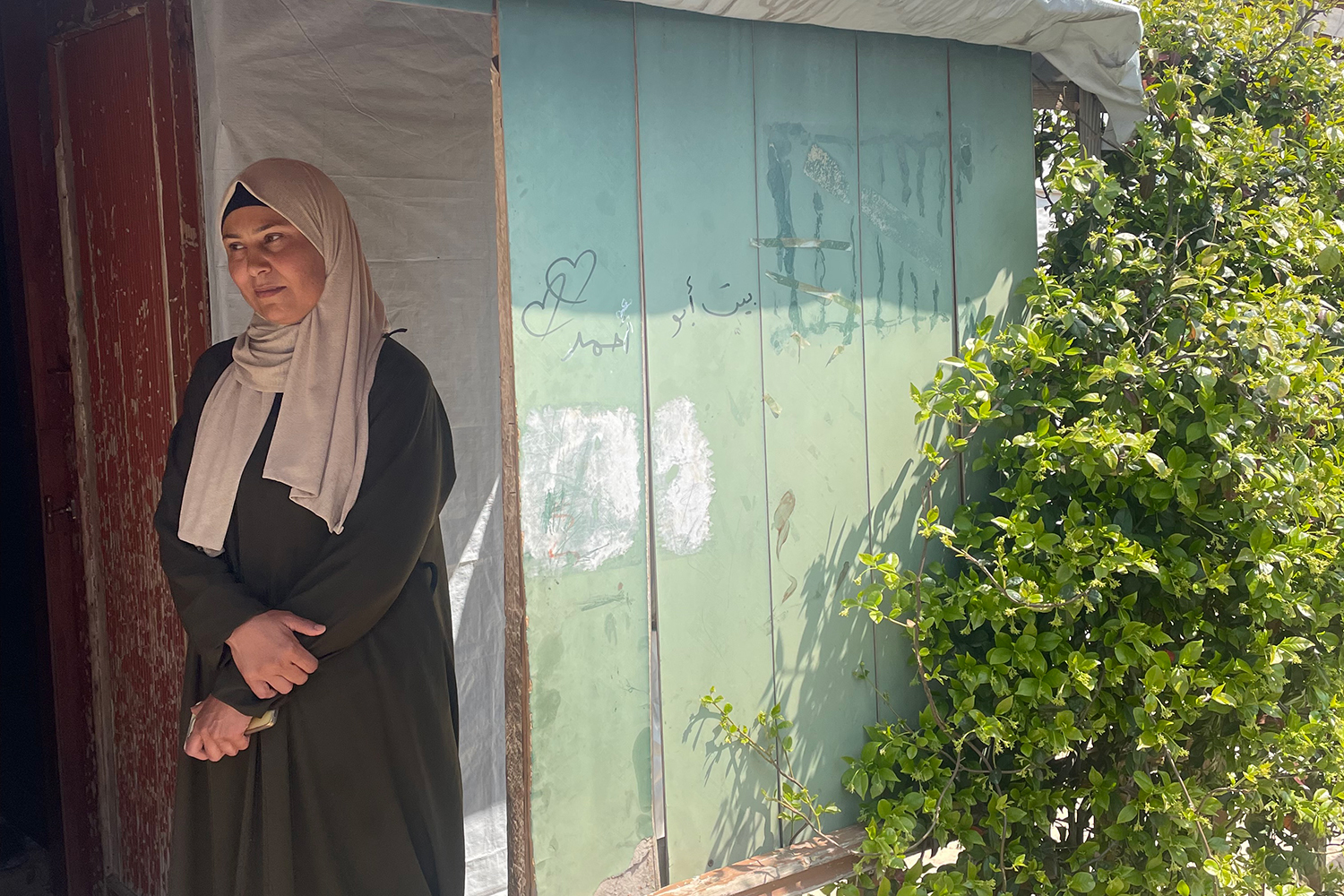 The shawish Hind poses at home in her camp just outside Saadnayel
