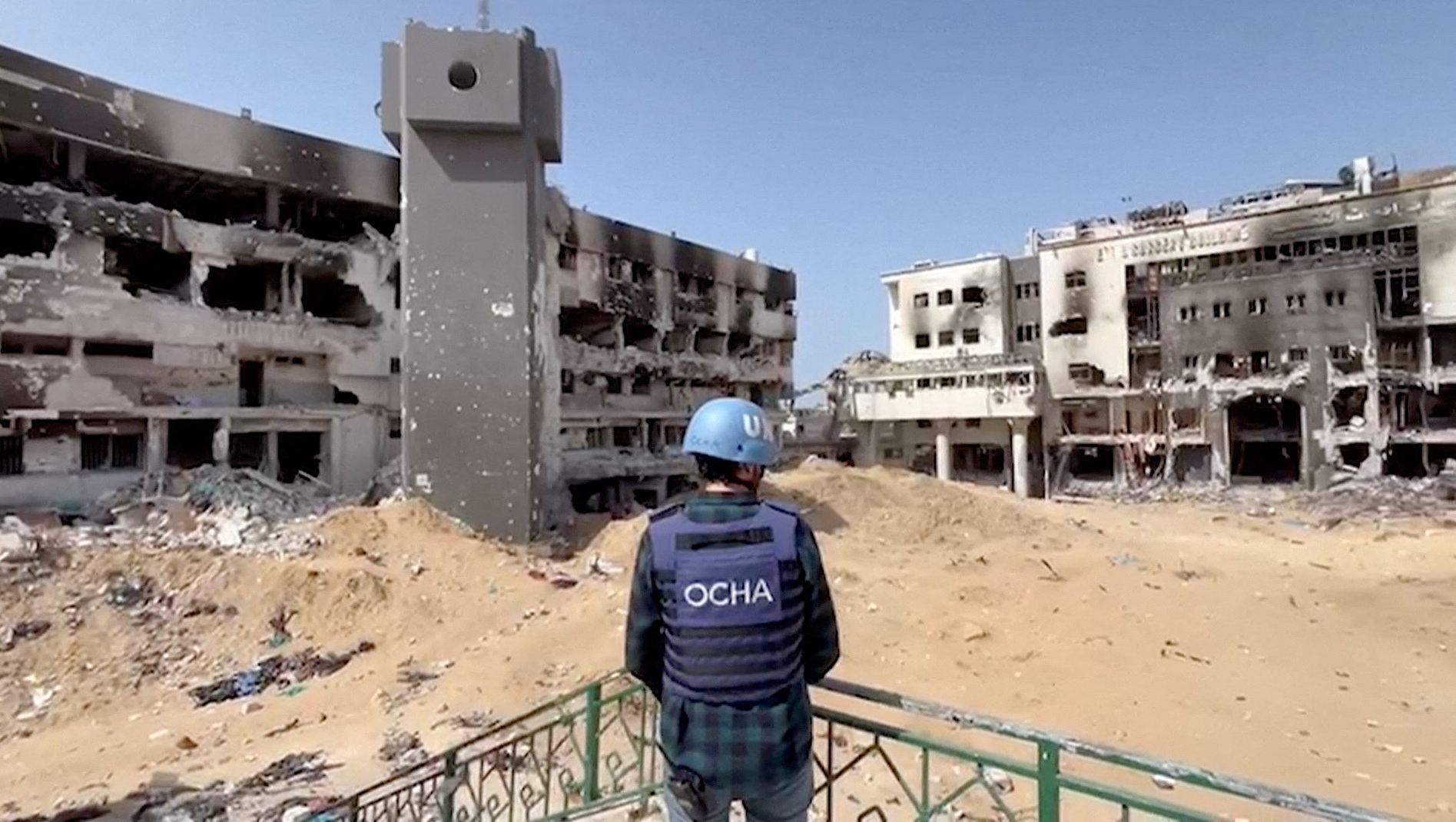Jonathan Whittall, an OCHA official, stands near the destroyed Al Shifa Hospital during an assessment by a UN Convoy, amid the ongoing conflict between Israel and Hamas, in Gaza City, April 5, 2024, in this screen grab taken from a handout video. OCHA/Handout via REUTERS THIS IMAGE HAS BEEN SUPPLIED BY A THIRD PARTY. MANDATORY CREDIT. NO RESALES. NO ARCHIVES.