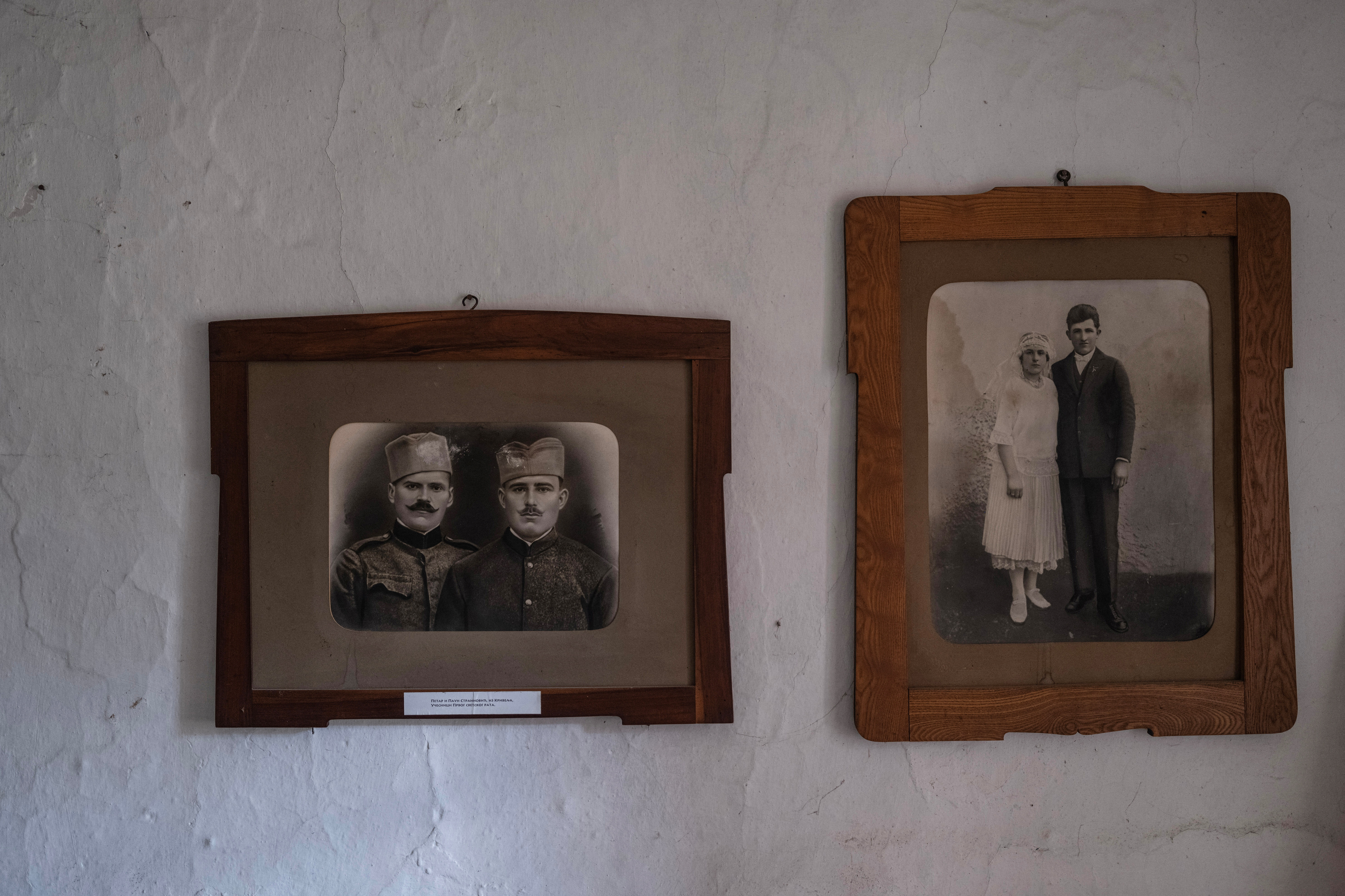 Framed pictures of soldiers returned from World War I and of relatives hang on the wall of an old house owned by Tomic family in the village of Krivelj, Serbia, April 4