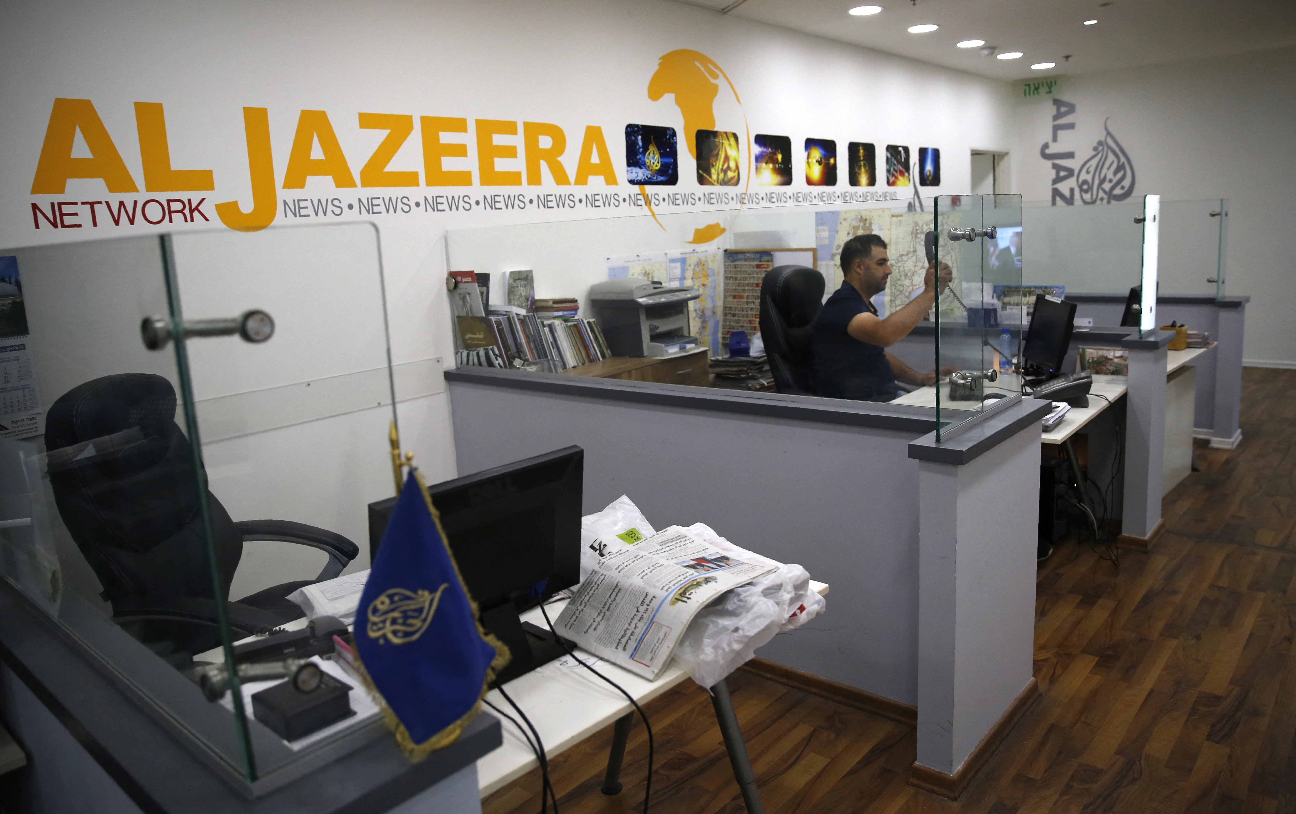 An employee of the Qatar based news network and TV channel Al-Jazeera is seen at the channel's Jerusalem office