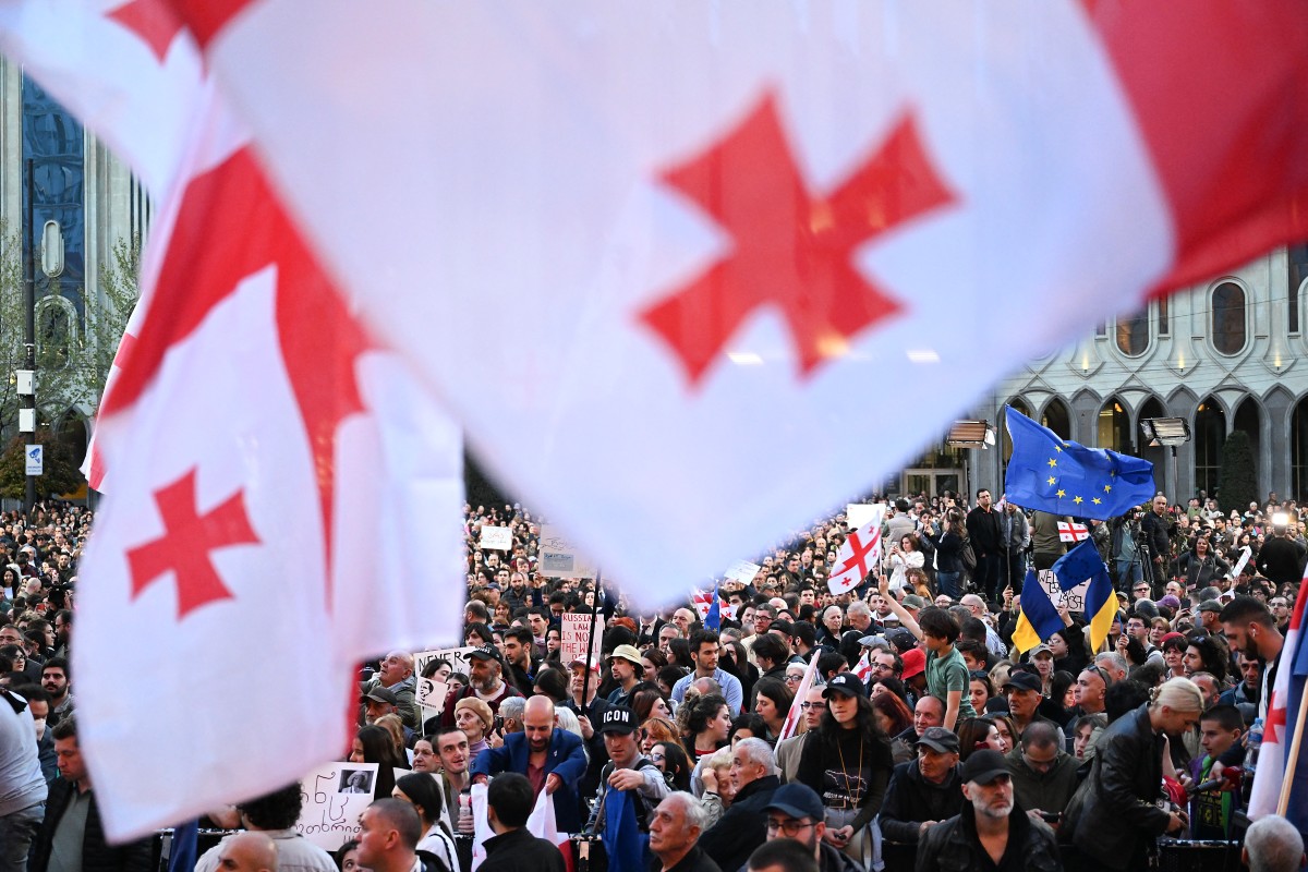Georgian pro-democracy groups activists protest against a repressive "foreign influence" bill outside the parliament
