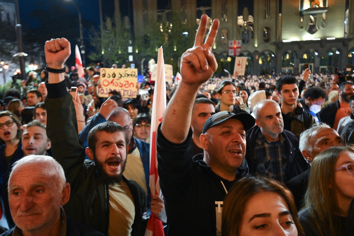 Georgian pro-democracy groups activists protest against a repressive "foreign influence" bill outside the parliament