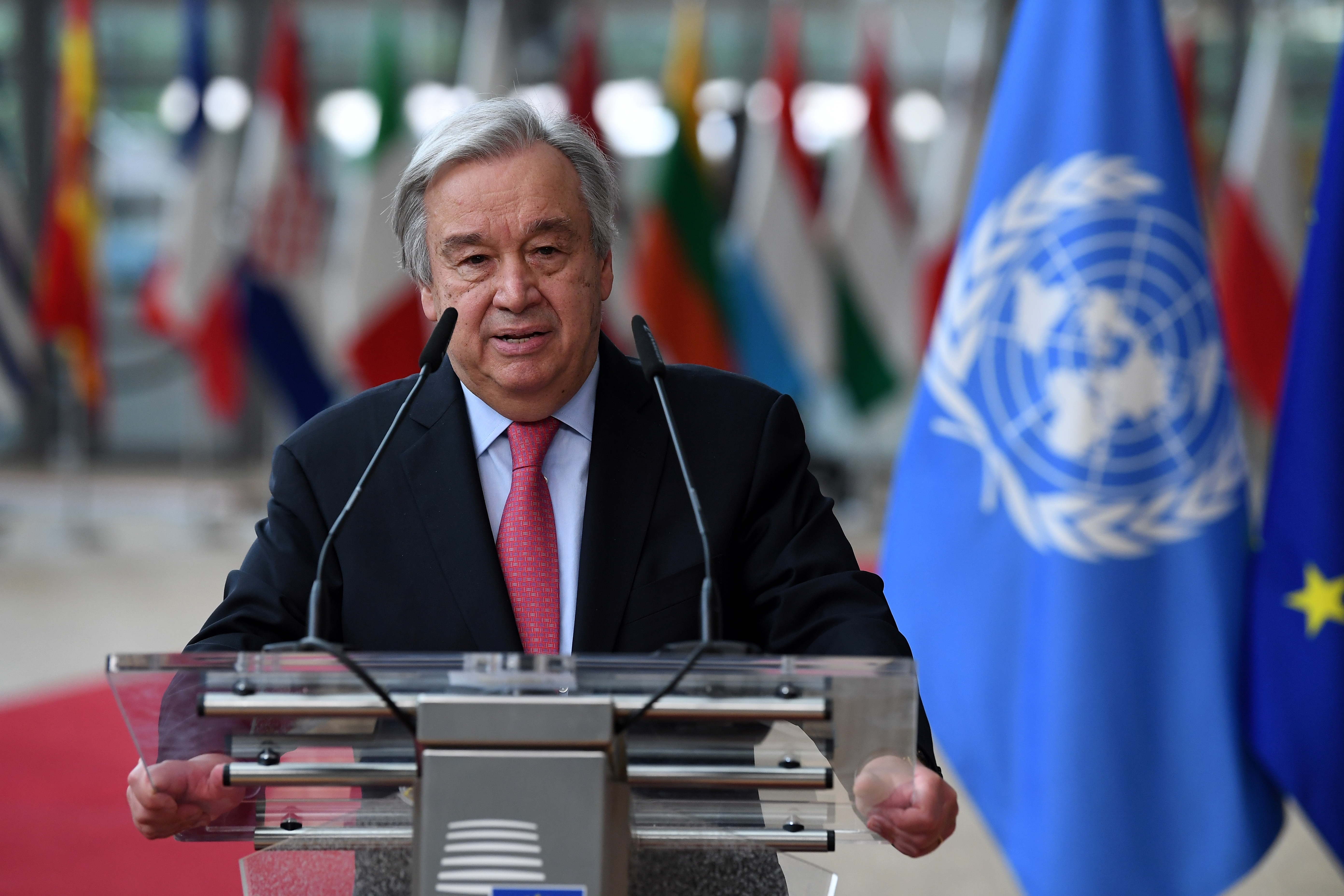 United Nations Secretary General Antonio Guterres addresses journalists next to European Council President Charles Michel during an EU summit at the European Council building in Brussels, Thursday, June 24, 2021. At their summit in Brussels, EU leaders are set to take stock of coronavirus recovery plans, study ways to improve relations with Russia and Turkey, and insist on the need to develop migration partners with the countries of northern Africa, but a heated exchange over a new LGBT bill in Hungary is also likely. (John Thys, Pool Photo via AP)