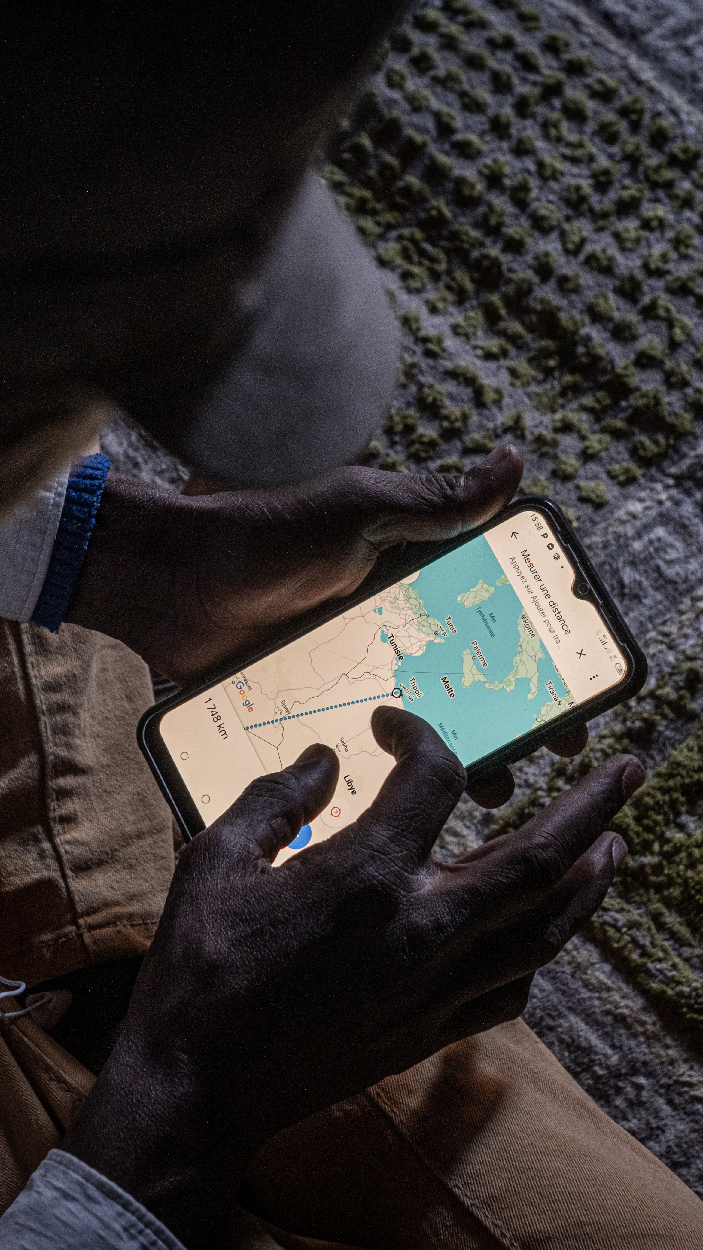 Kouyate shows the distance between Agadez and Tripoli, Libya