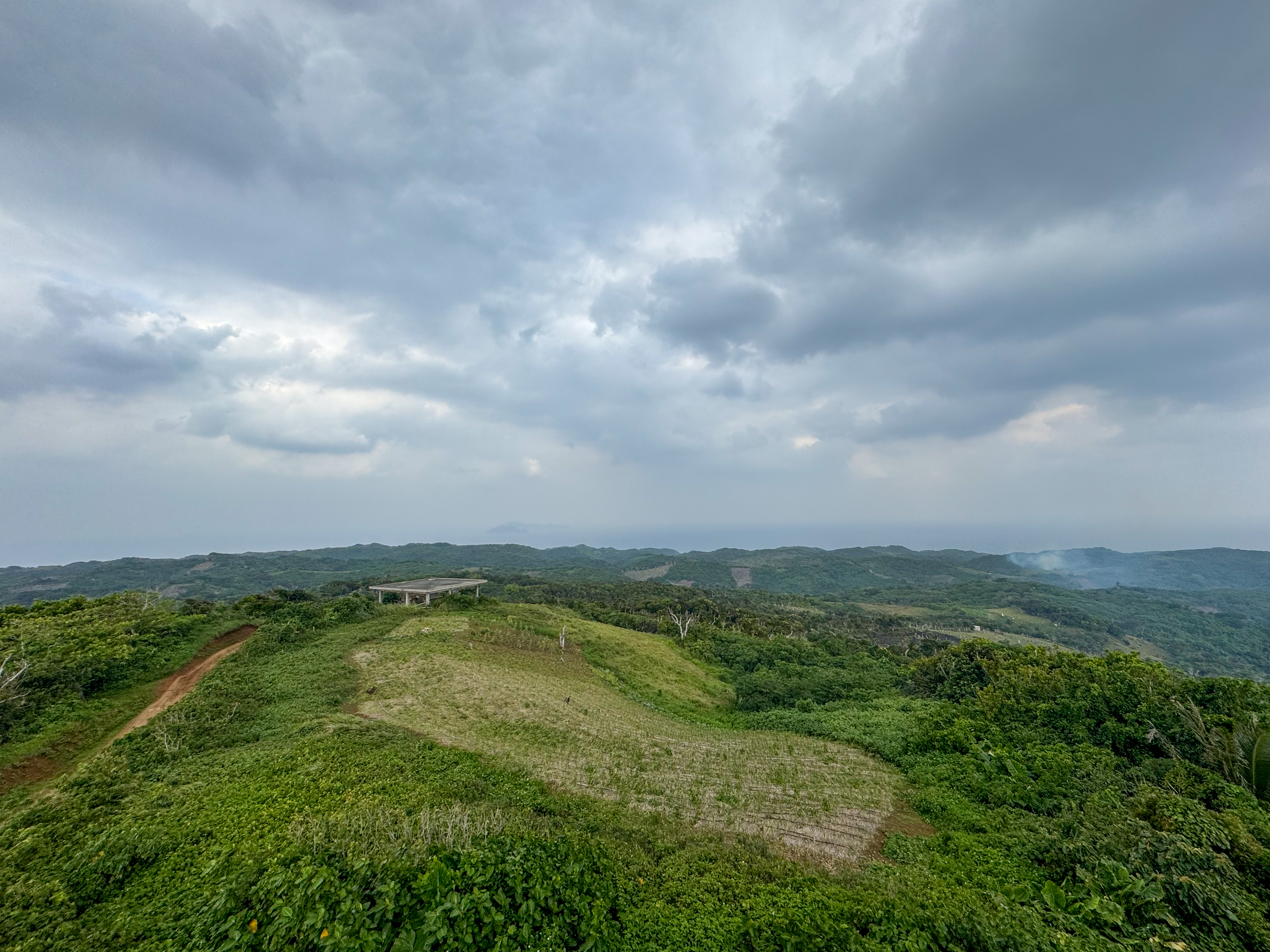 A view of the site for a new naval outlook station in Itbayat. I is on a hill. There is lots of greenery around.