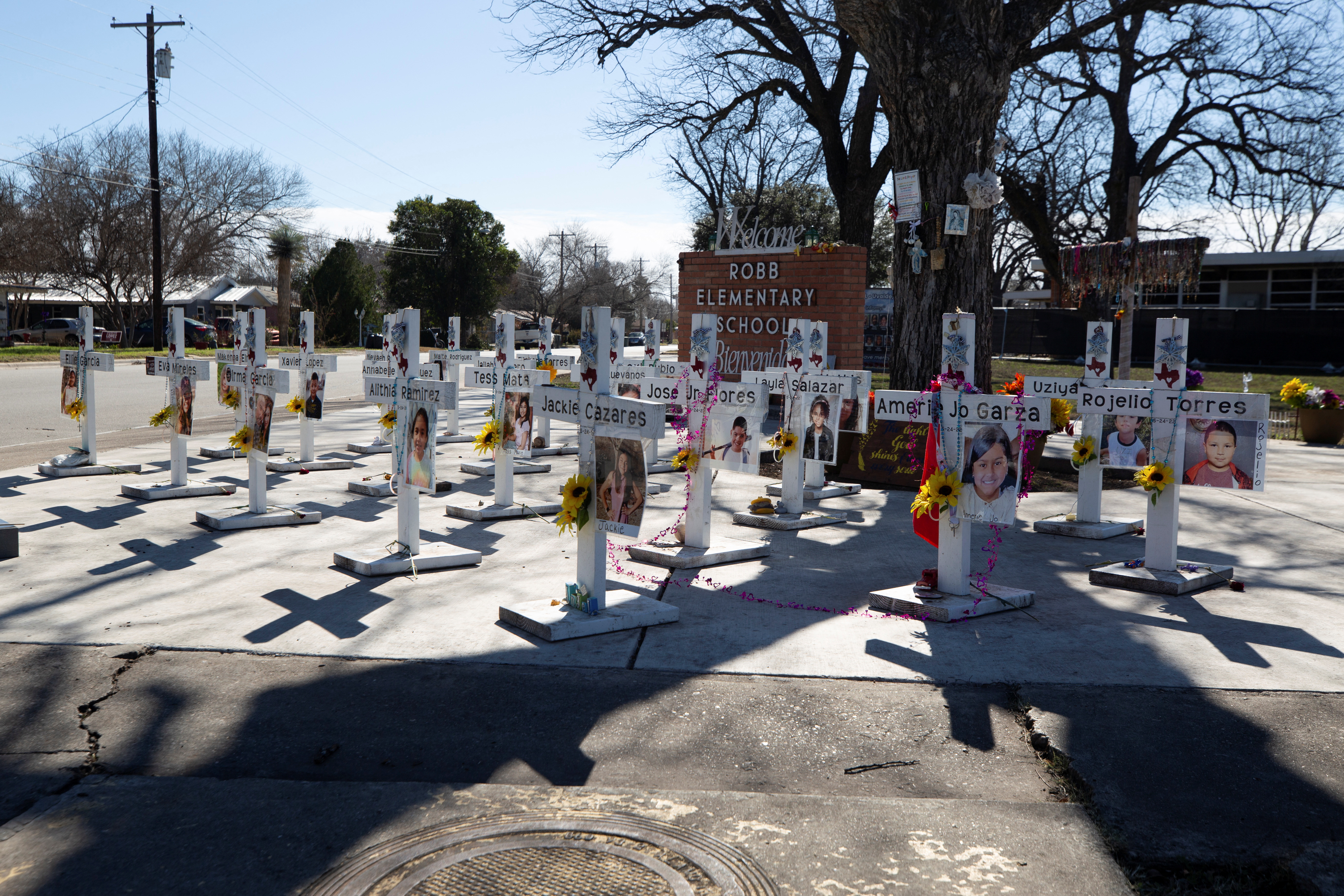 Memorial crosses stand in front of Robb Elementary School, as U.S. Attorney General Merrick Garland announces the results of a review into the law enforcement response to a 2022 mass shooting in Uvalde, Texas, U.S., January 18, 2024. REUTERS/Kaylee Greenlee Beal